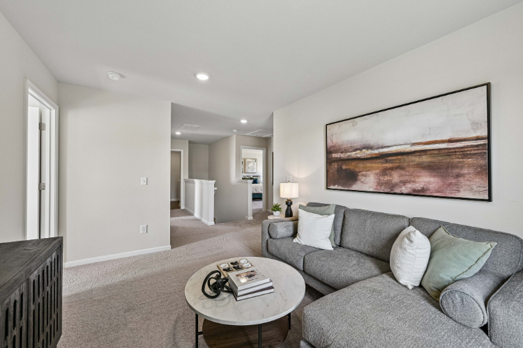 A living room with a couch and a coffee table.