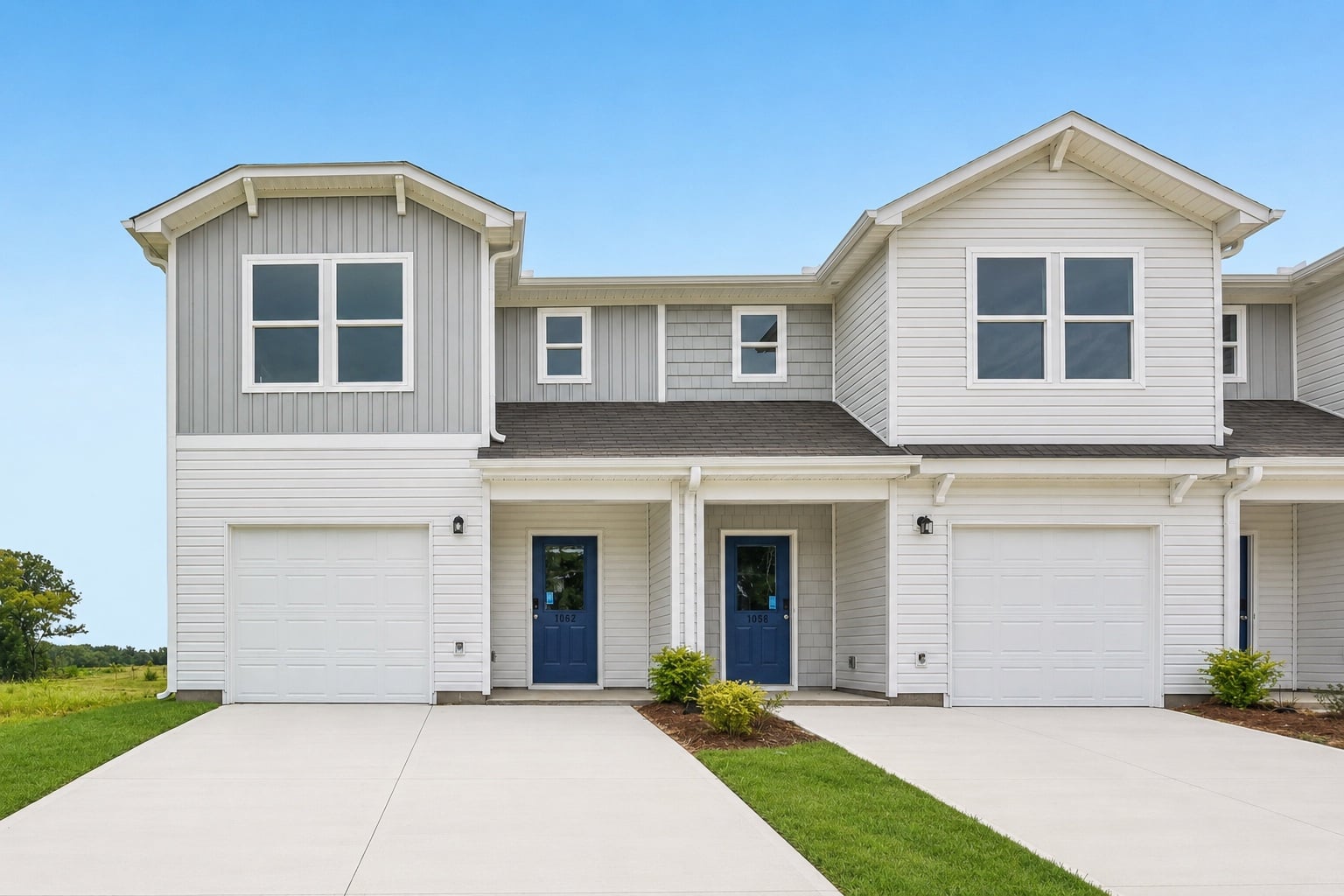 A house with garages and a driveway.