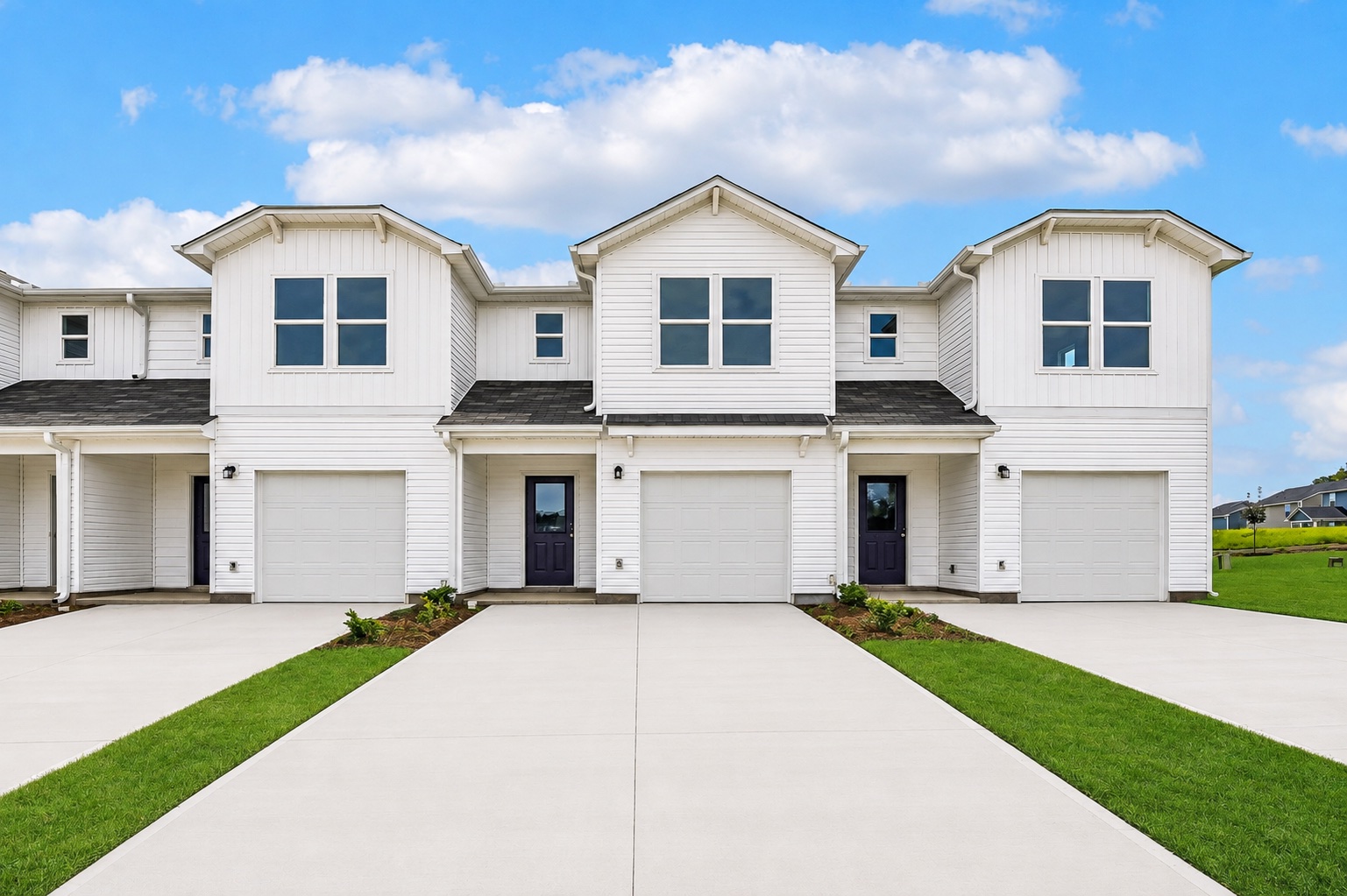 A white house with a driveway.