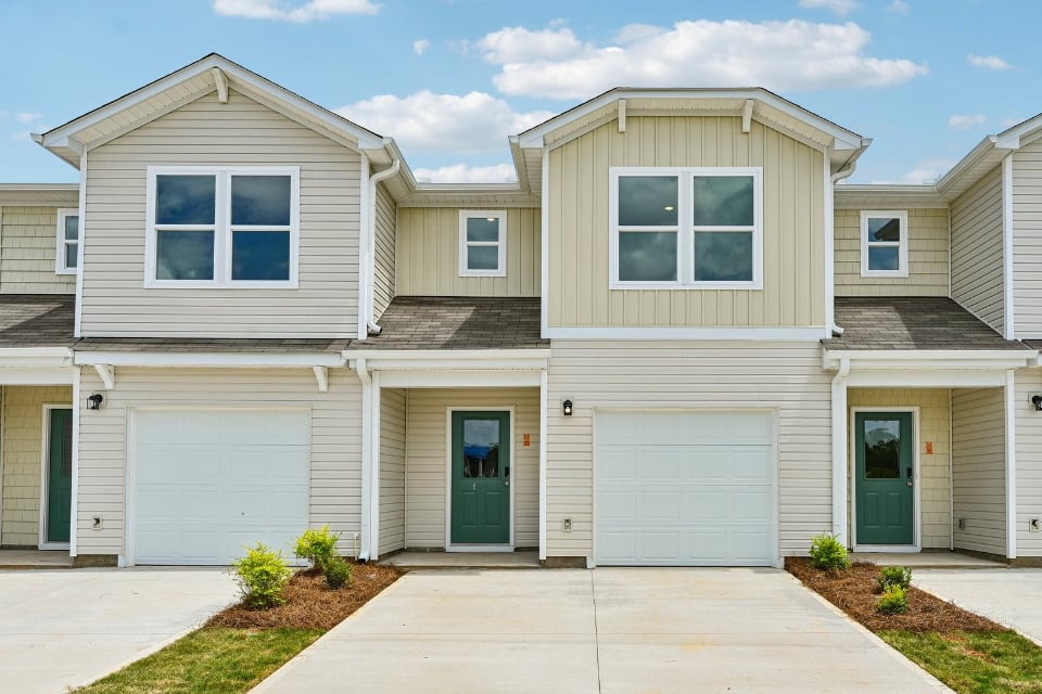 A house with garages and a driveway.