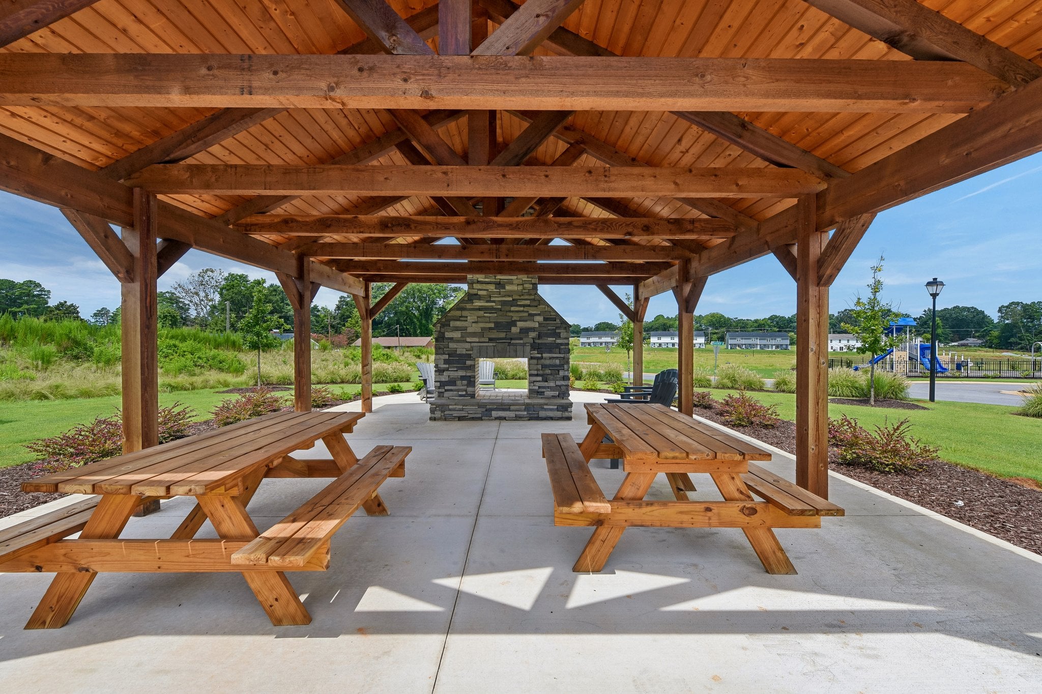 A picnic table under a covered area.