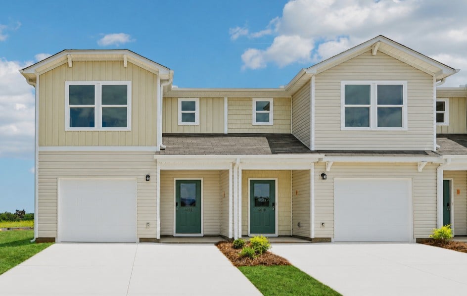 A house with garages and a driveway.