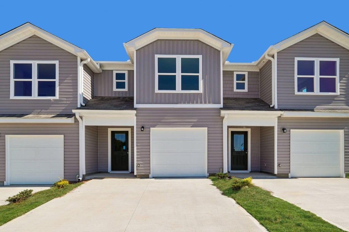 A house with garages and a driveway.