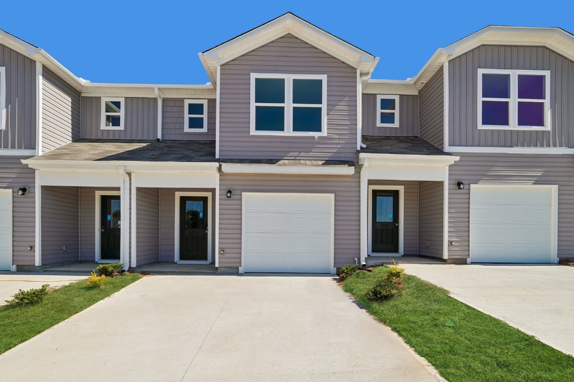 A house with garages and a driveway.