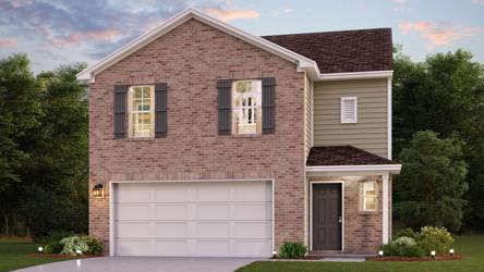 A large brick house with a garage.