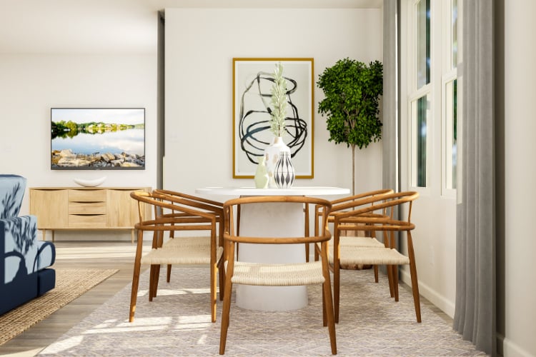 A dining room with a table and chairs.