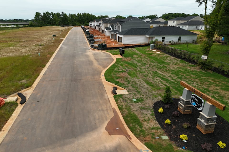 A road with houses on the side.