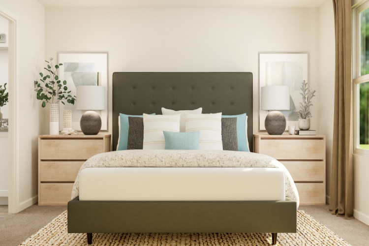 A bed with blue and white pillows.