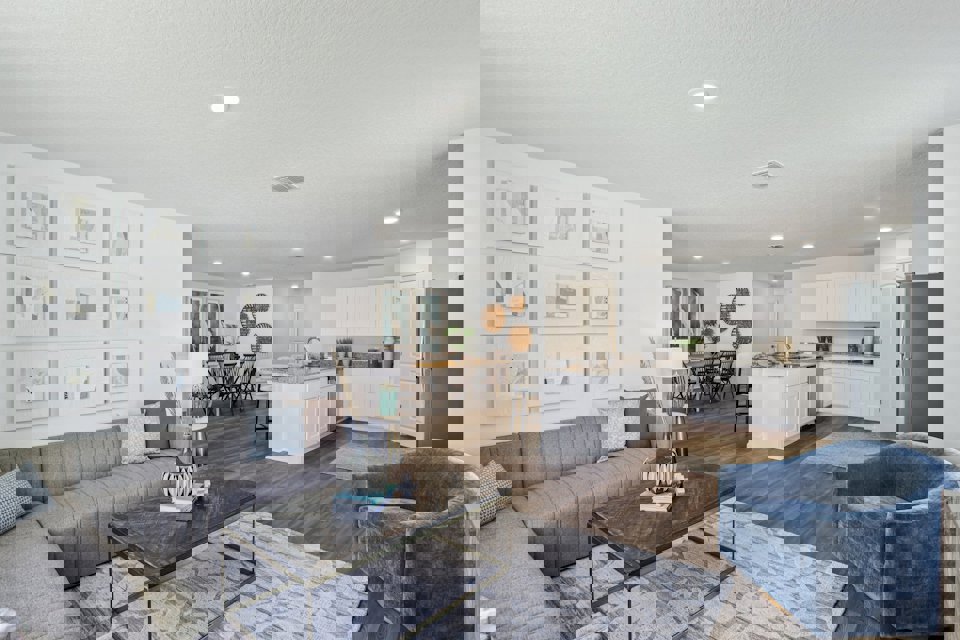 A living room with a couch and a table.