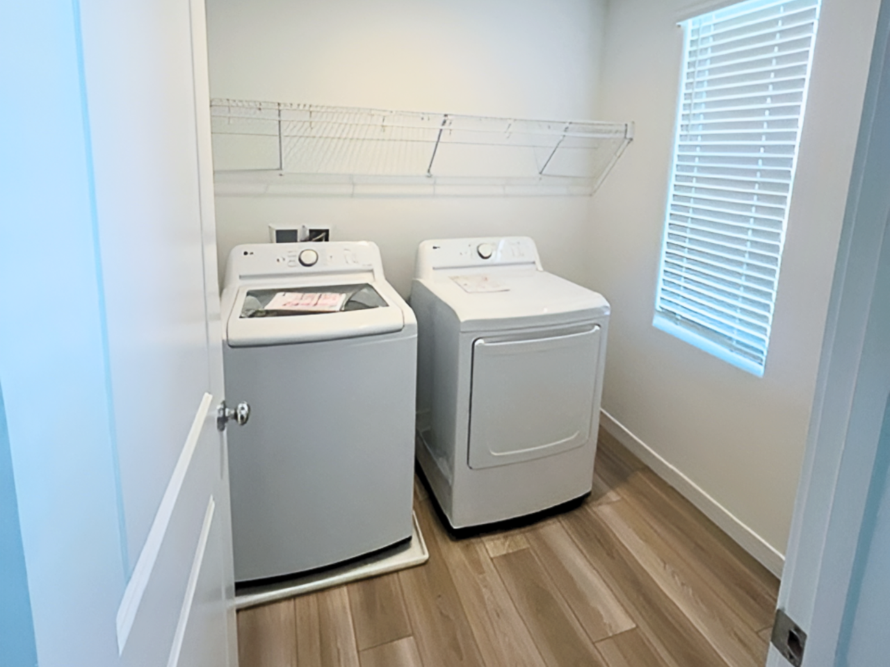 A laundry room with a washer and dryer.