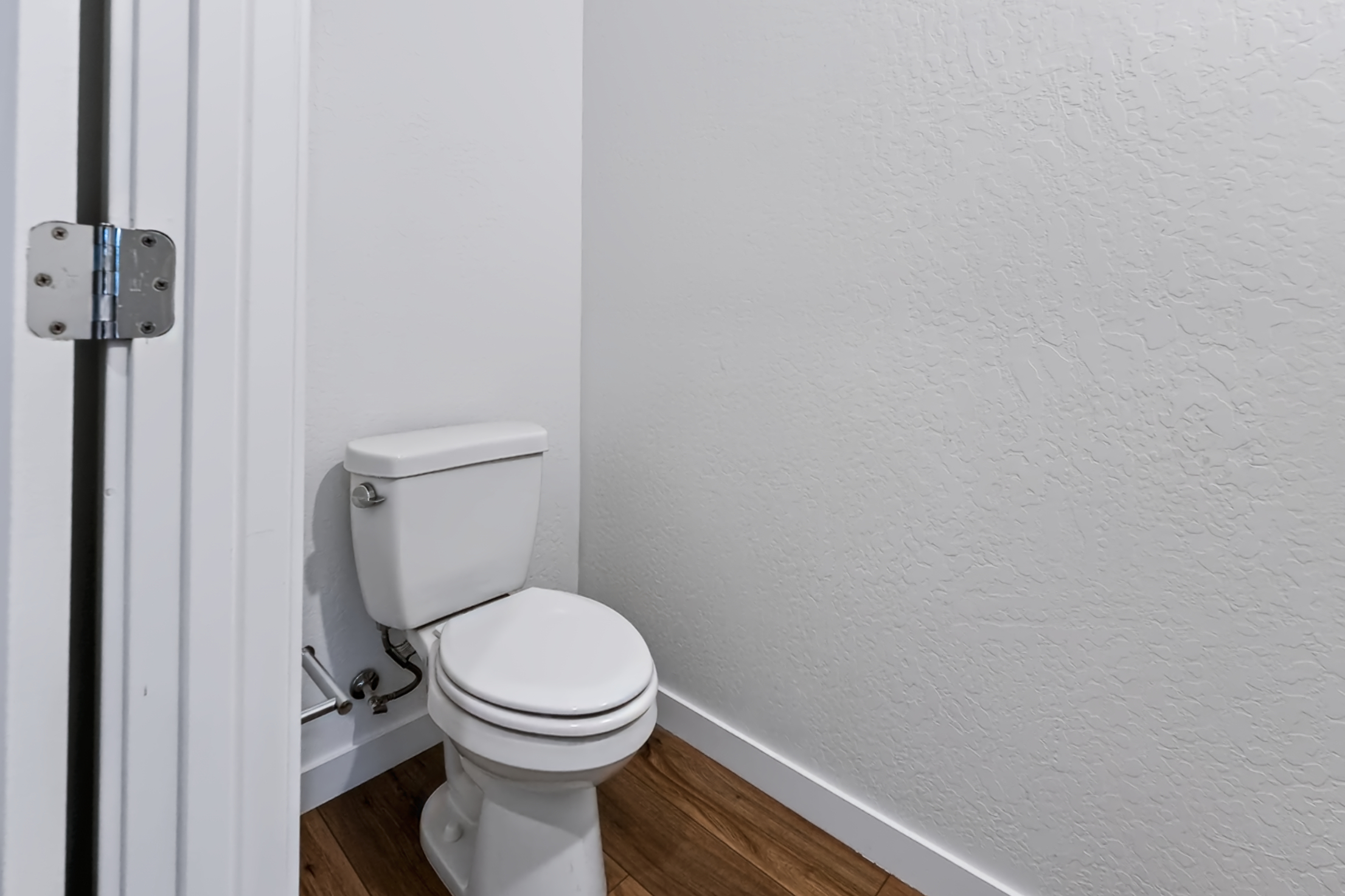 A toilet in a bathroom.