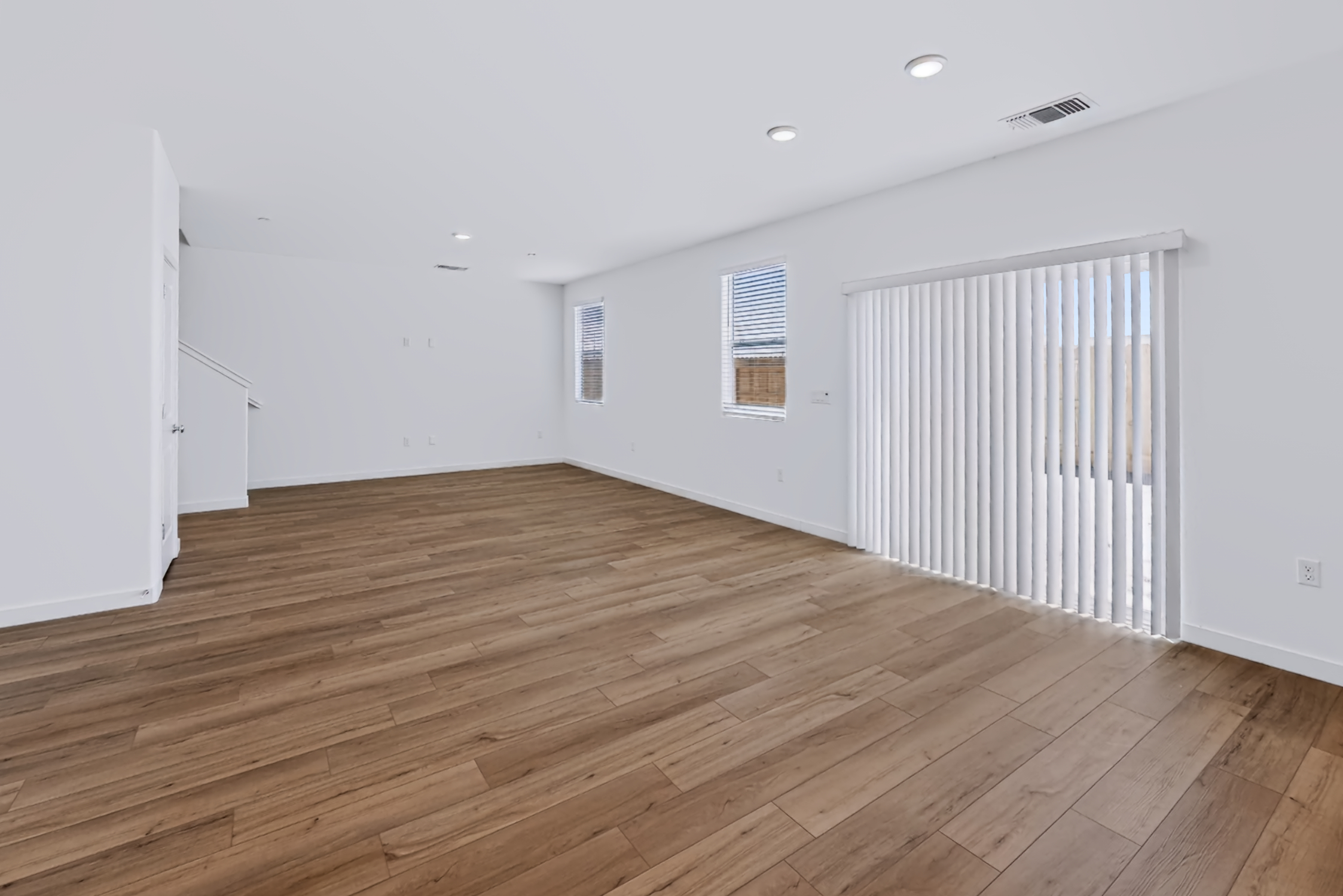A room with a wood floor and a wood floor.