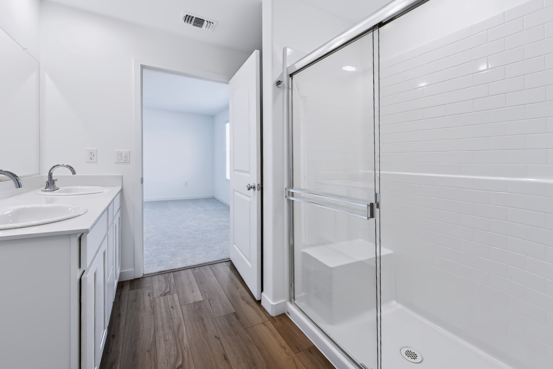 A bathroom with a glass shower.