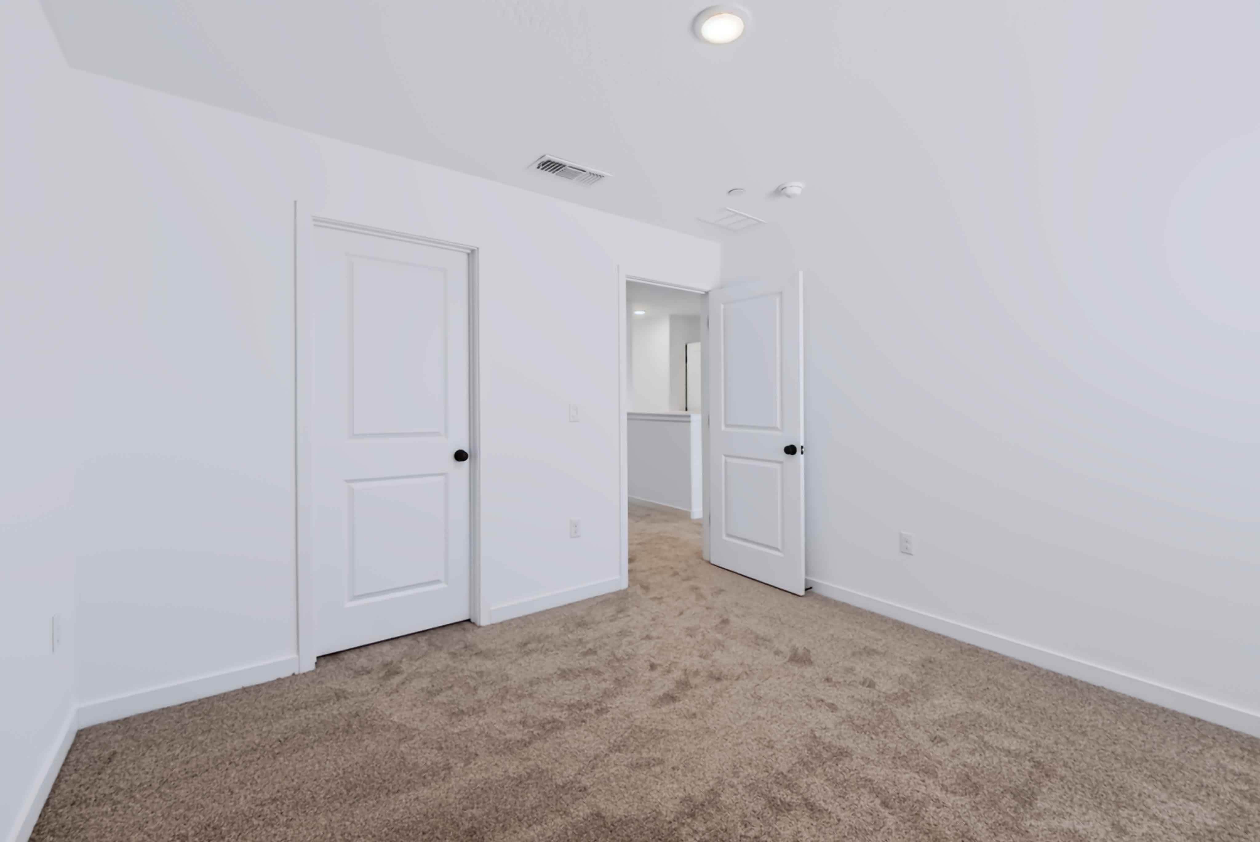 A room with white doors.