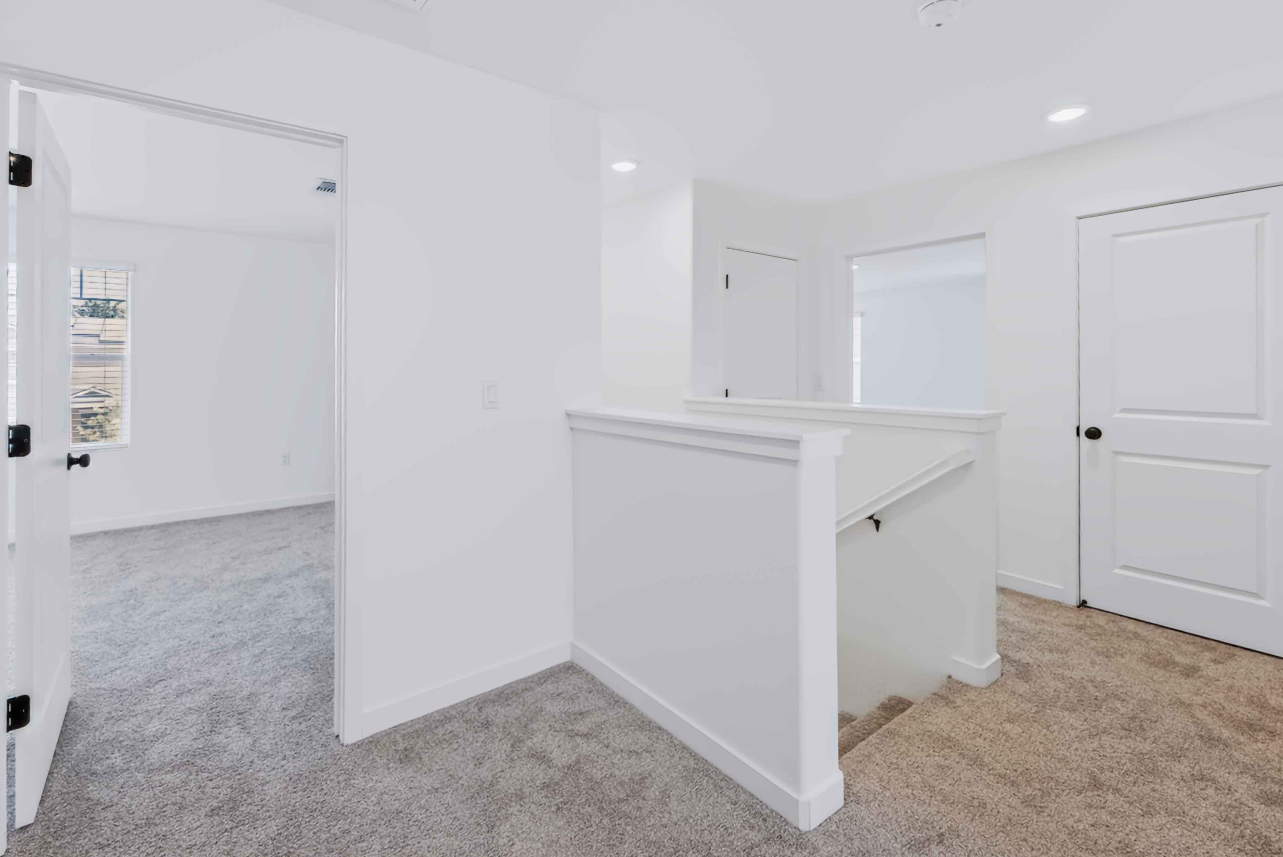 A room with white cabinets.