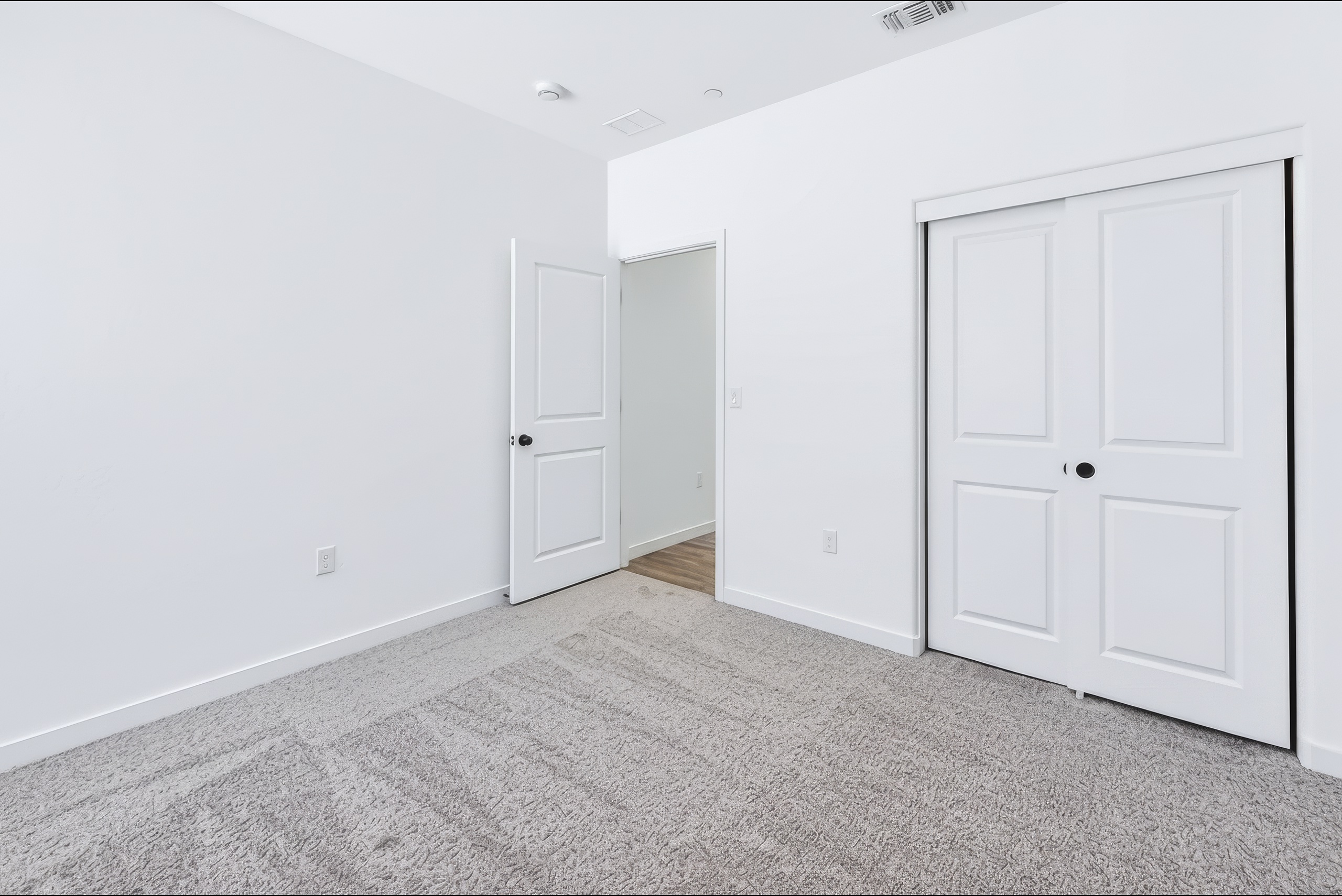A room with white doors.
