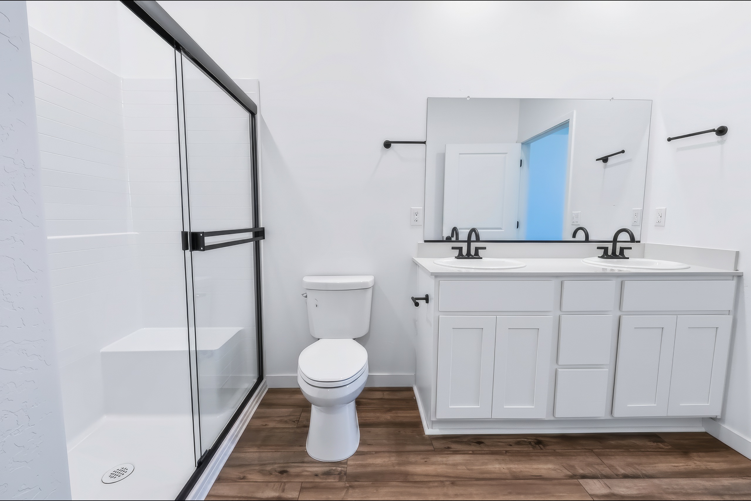 A bathroom with a toilet and sink.
