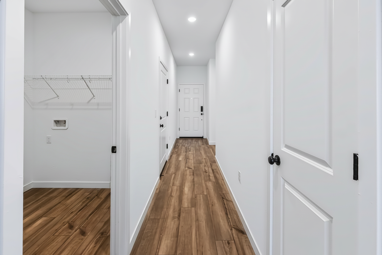 A hallway with white doors.