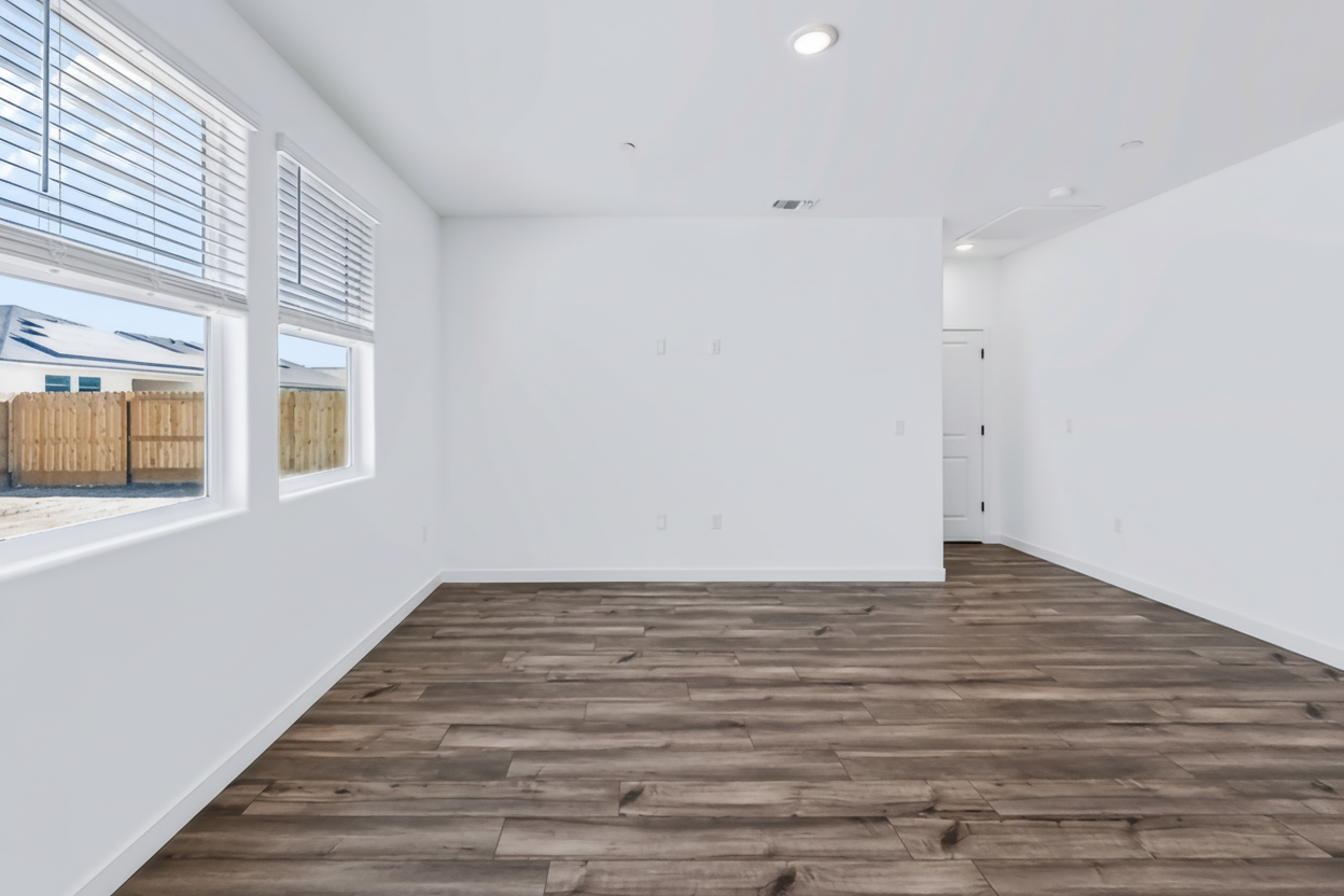 A room with a wood floor and a wood floor.