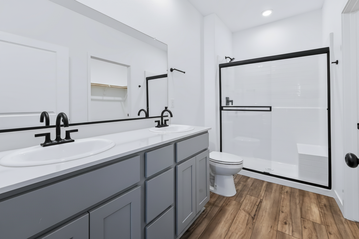 A bathroom with a sink and a toilet.