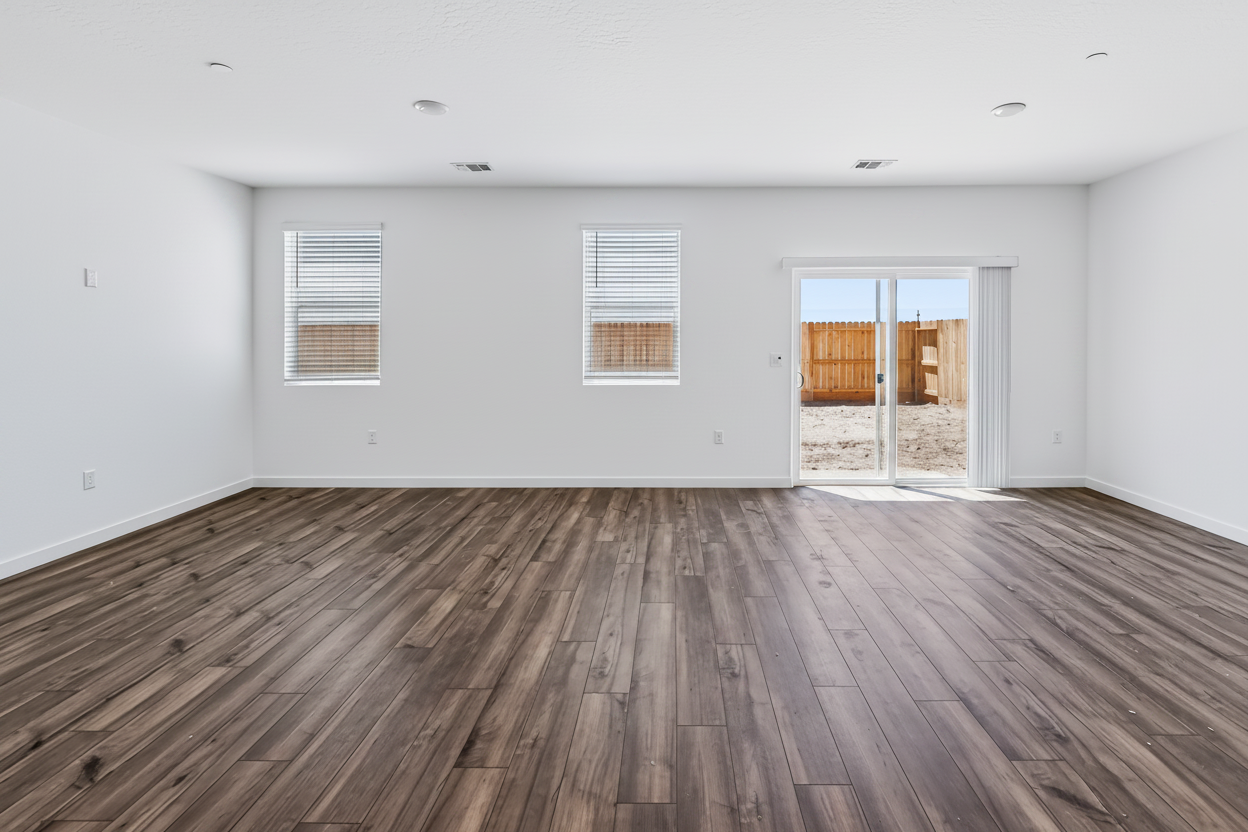 A room with a wood floor and a wood floor.
