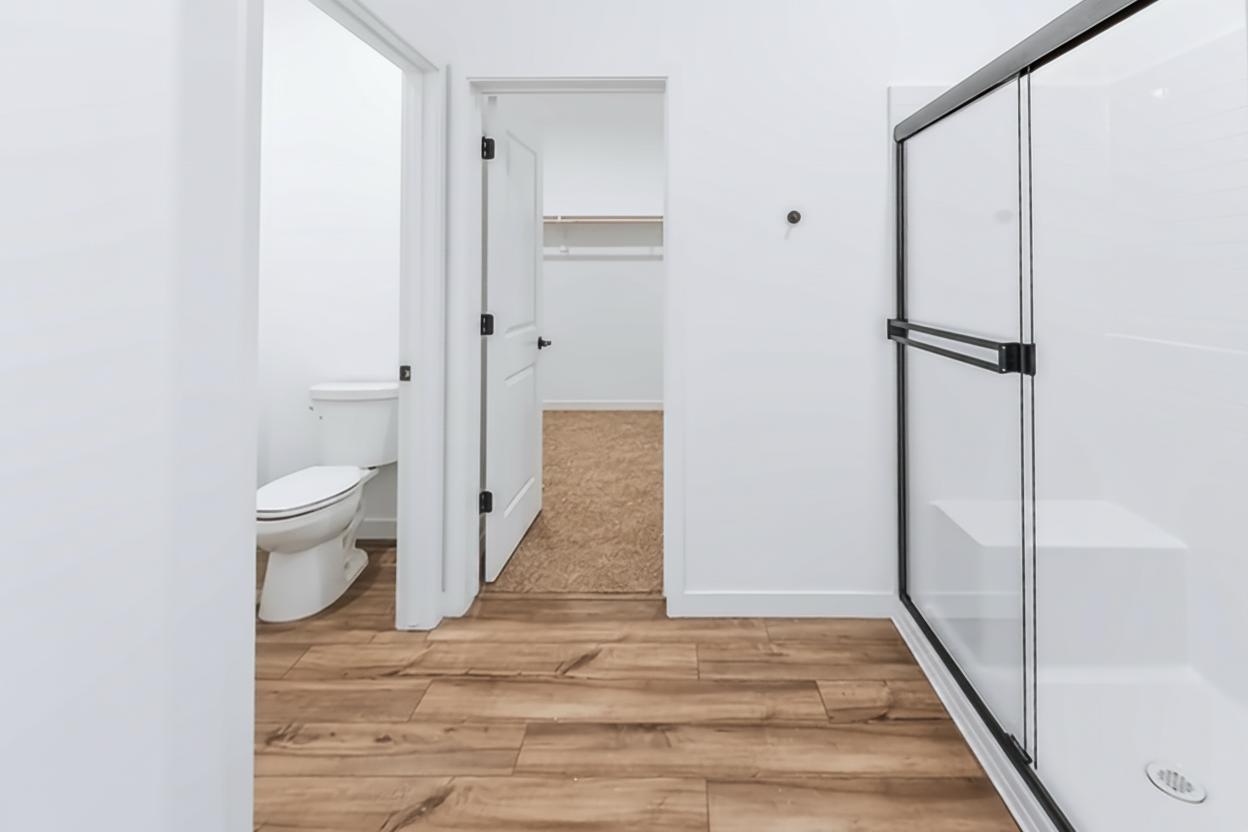 A bathroom with a glass shower.