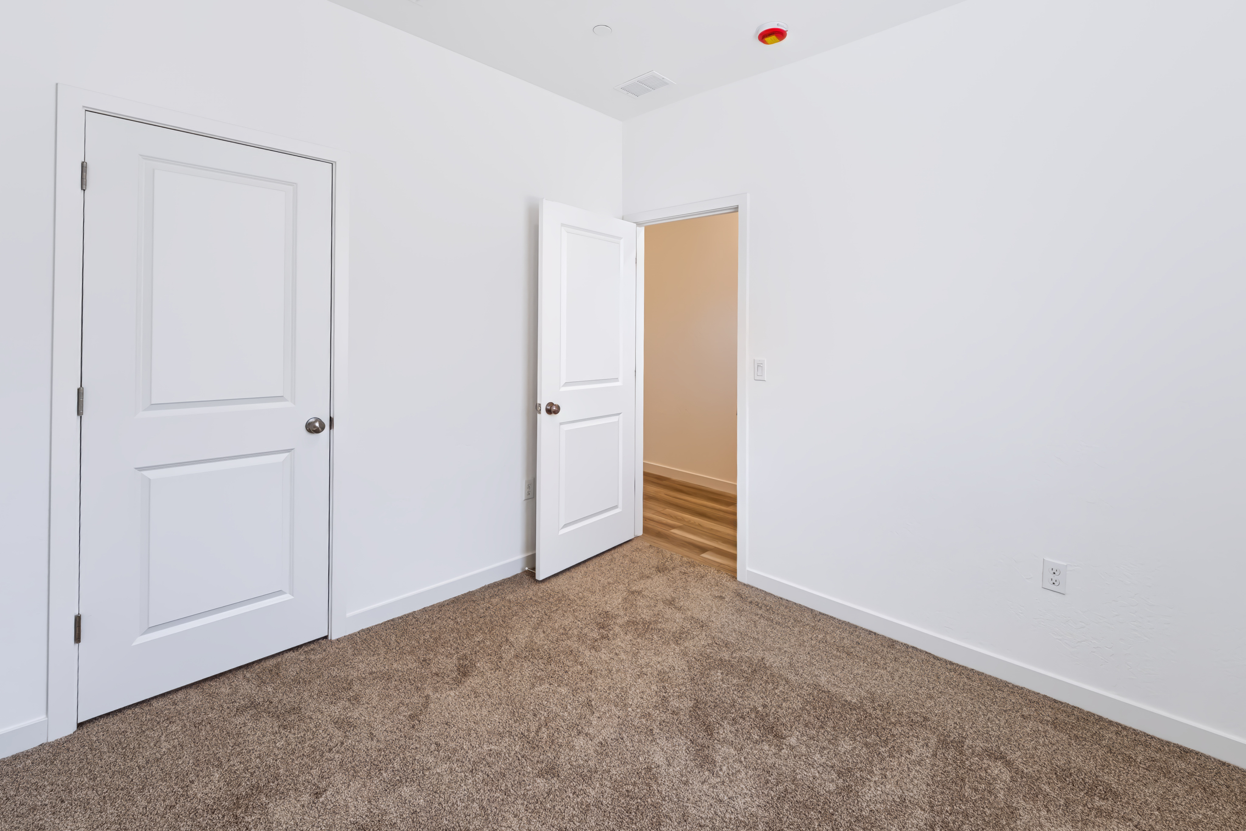 A room with white doors.