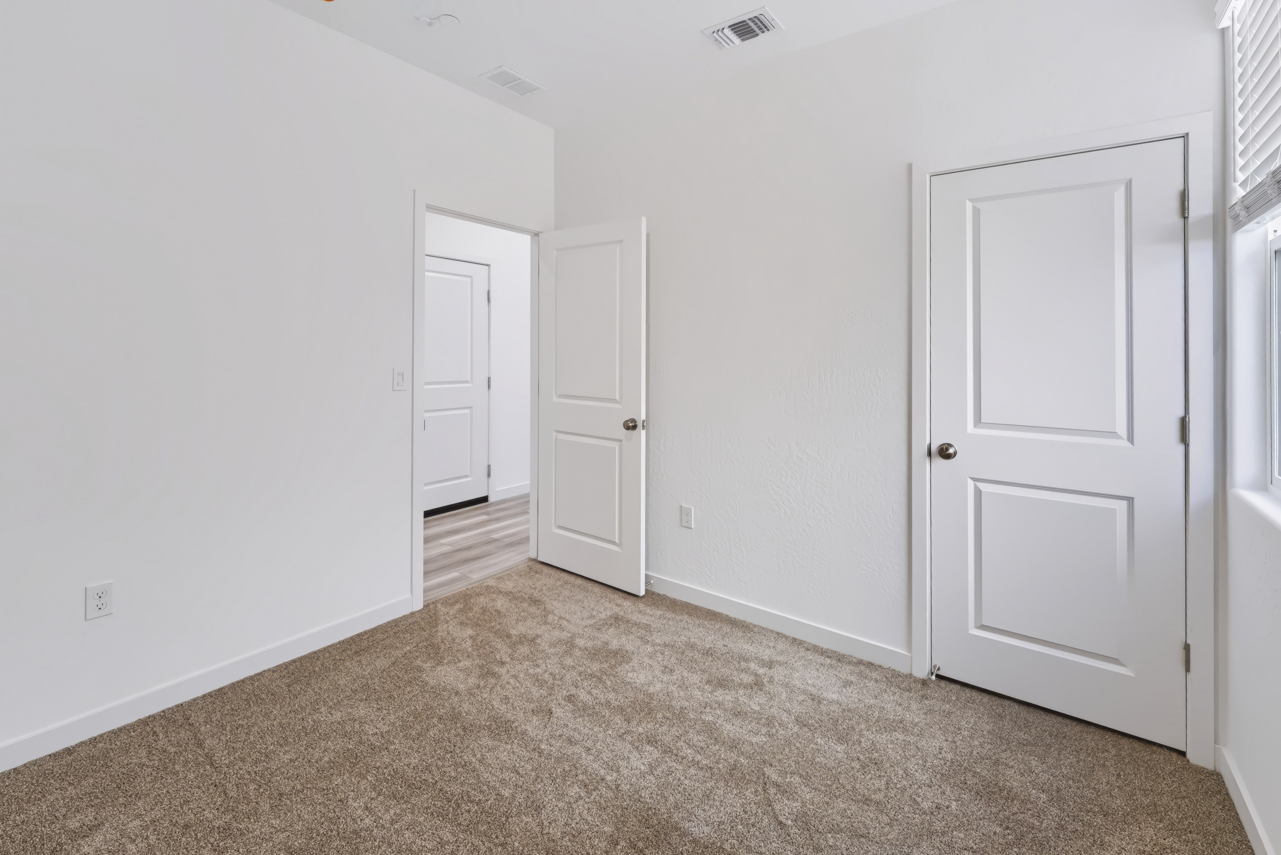 A room with white doors.