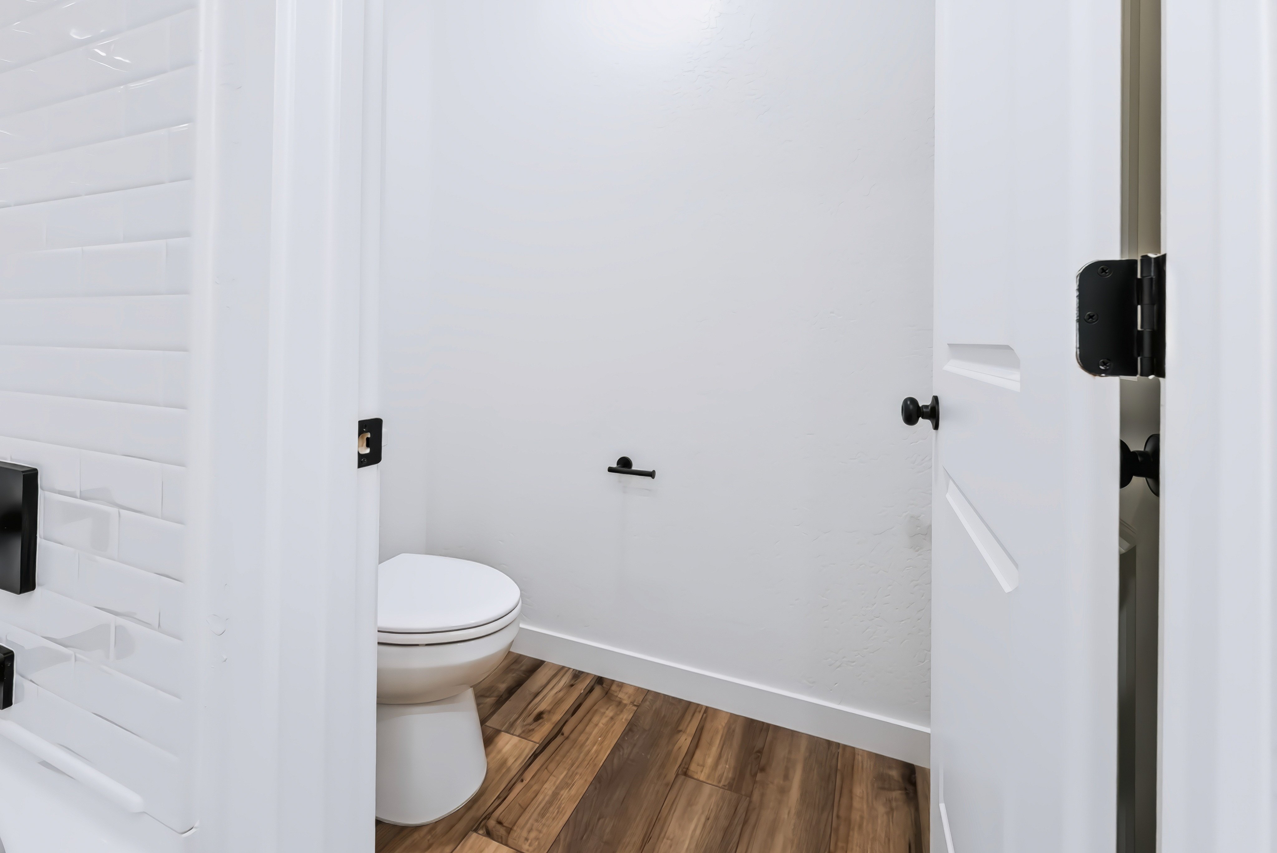 A toilet in a bathroom.