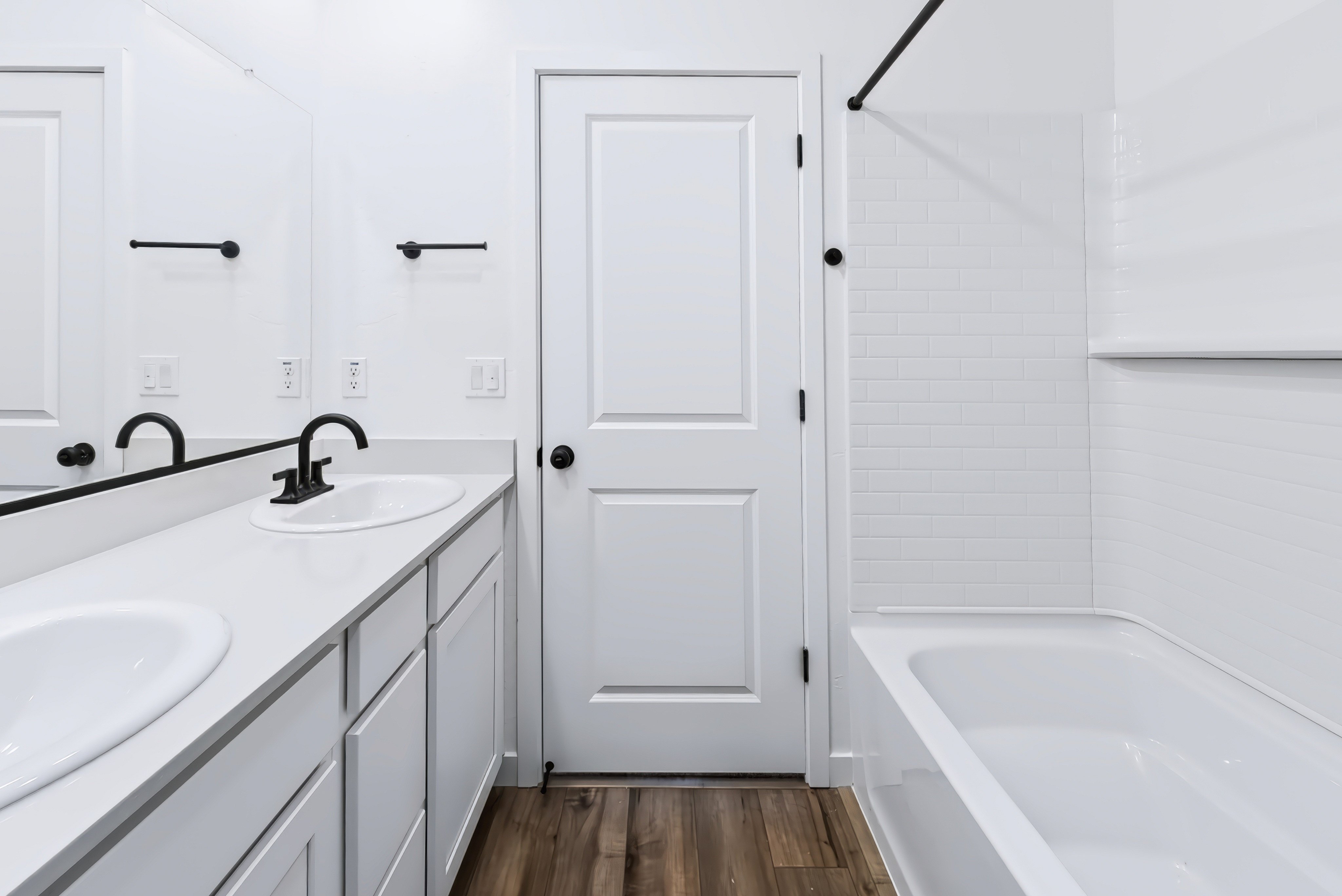 A bathroom with a sink and a bathtub.