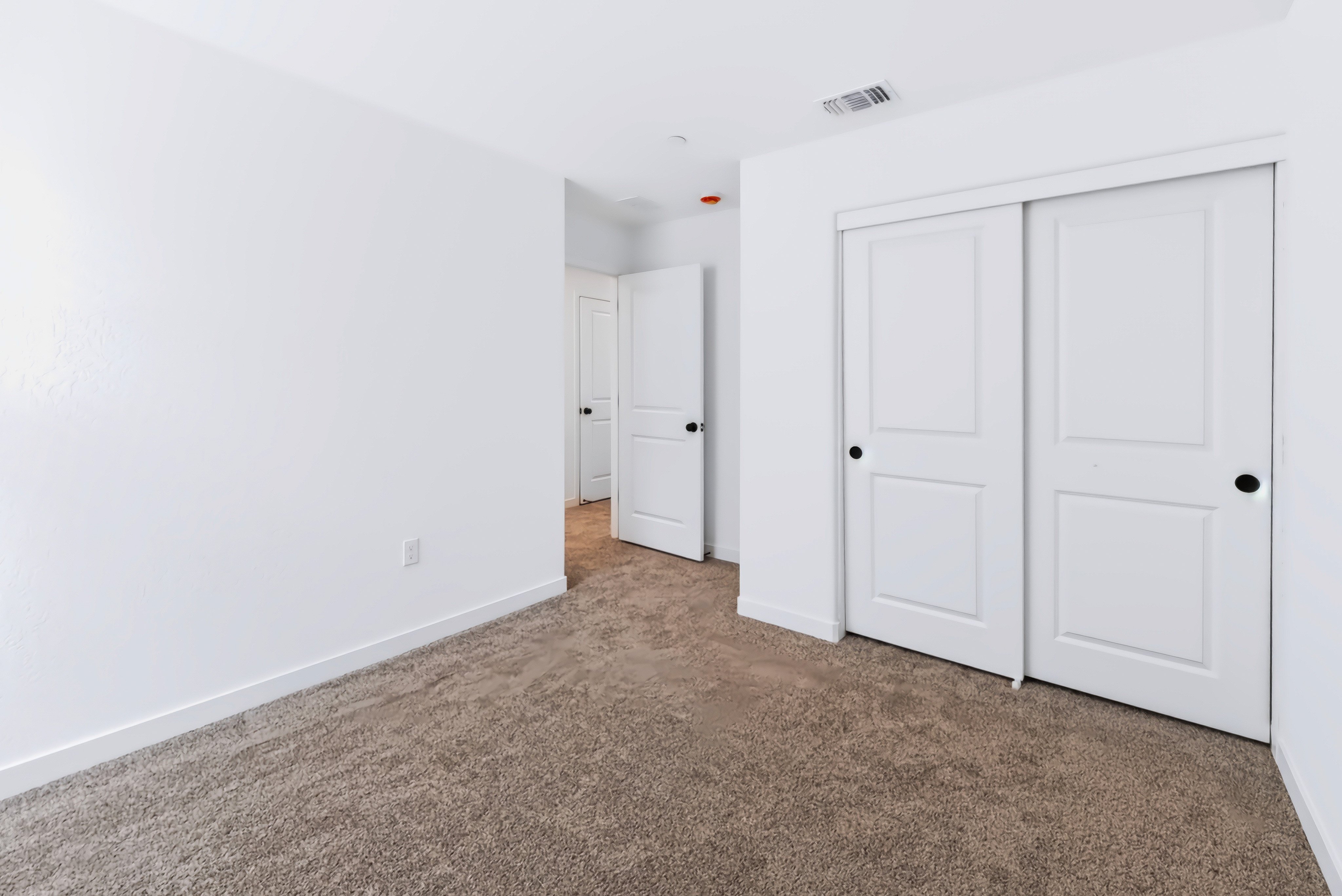 A room with white doors.