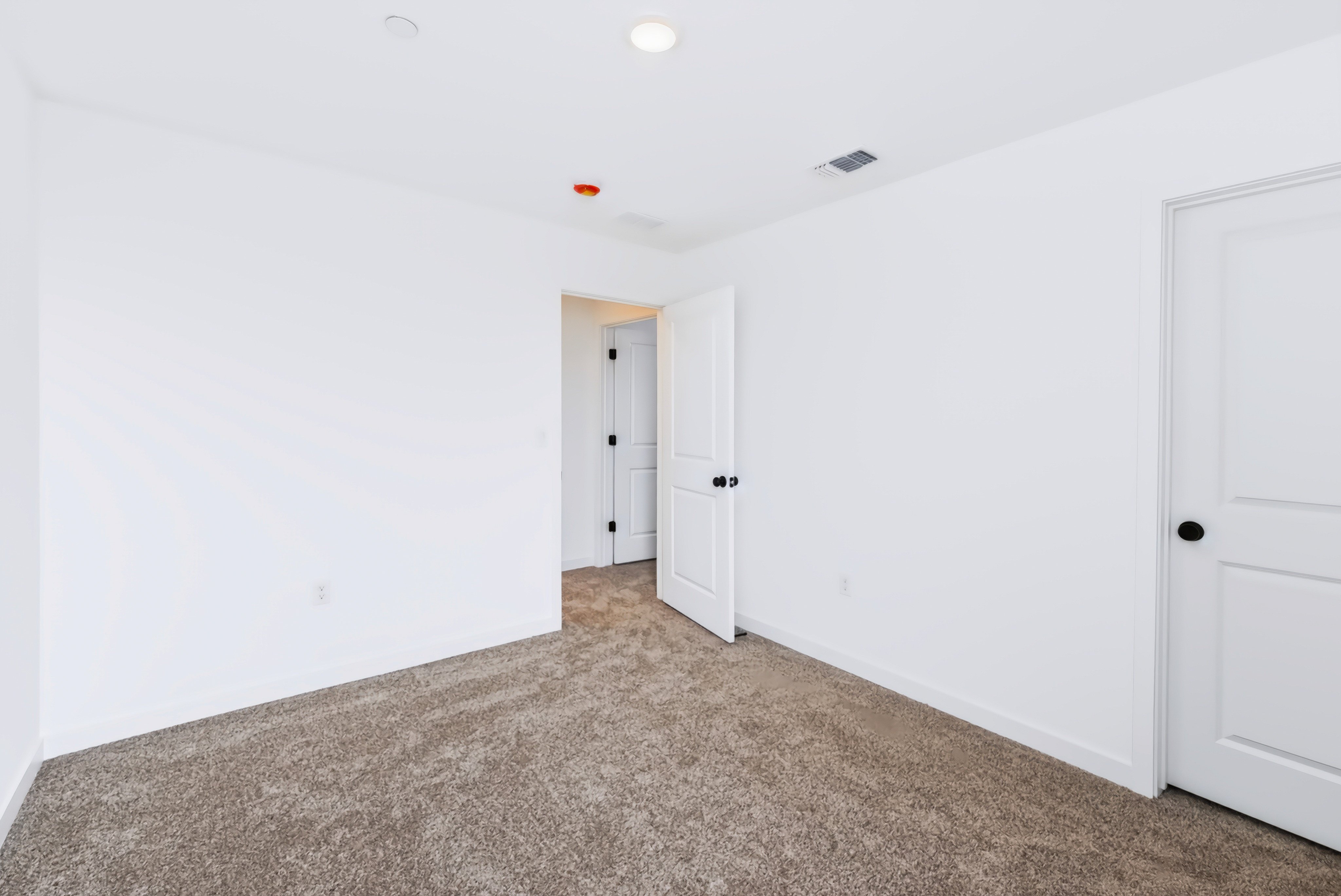 A room with white doors.