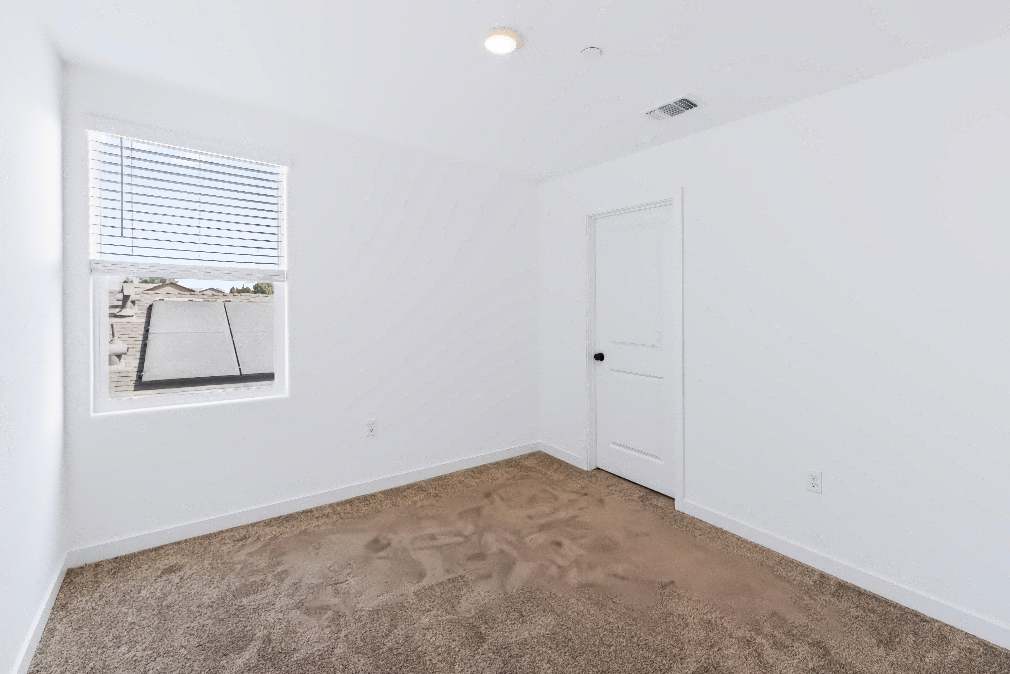 A room with a door and a window.