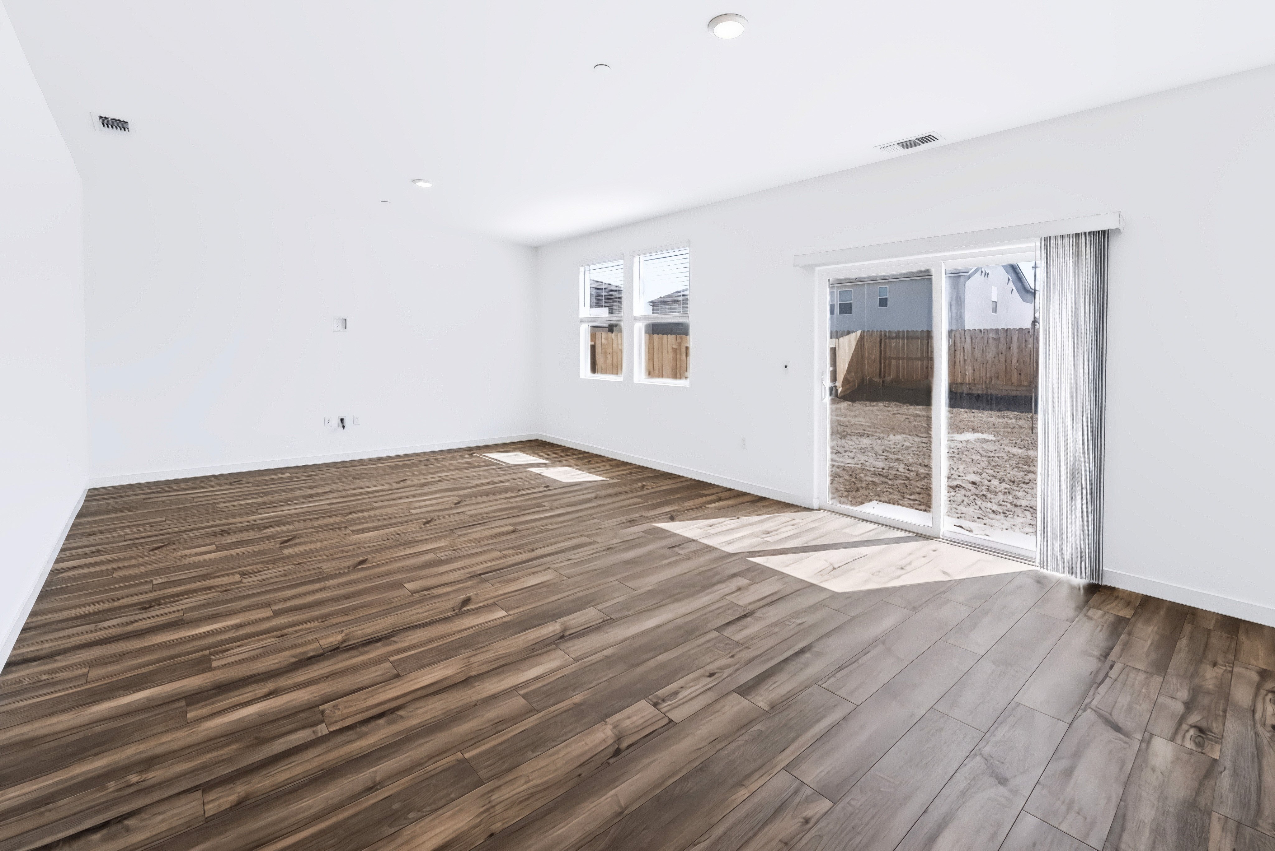 A room with a wood floor and a wood floor.