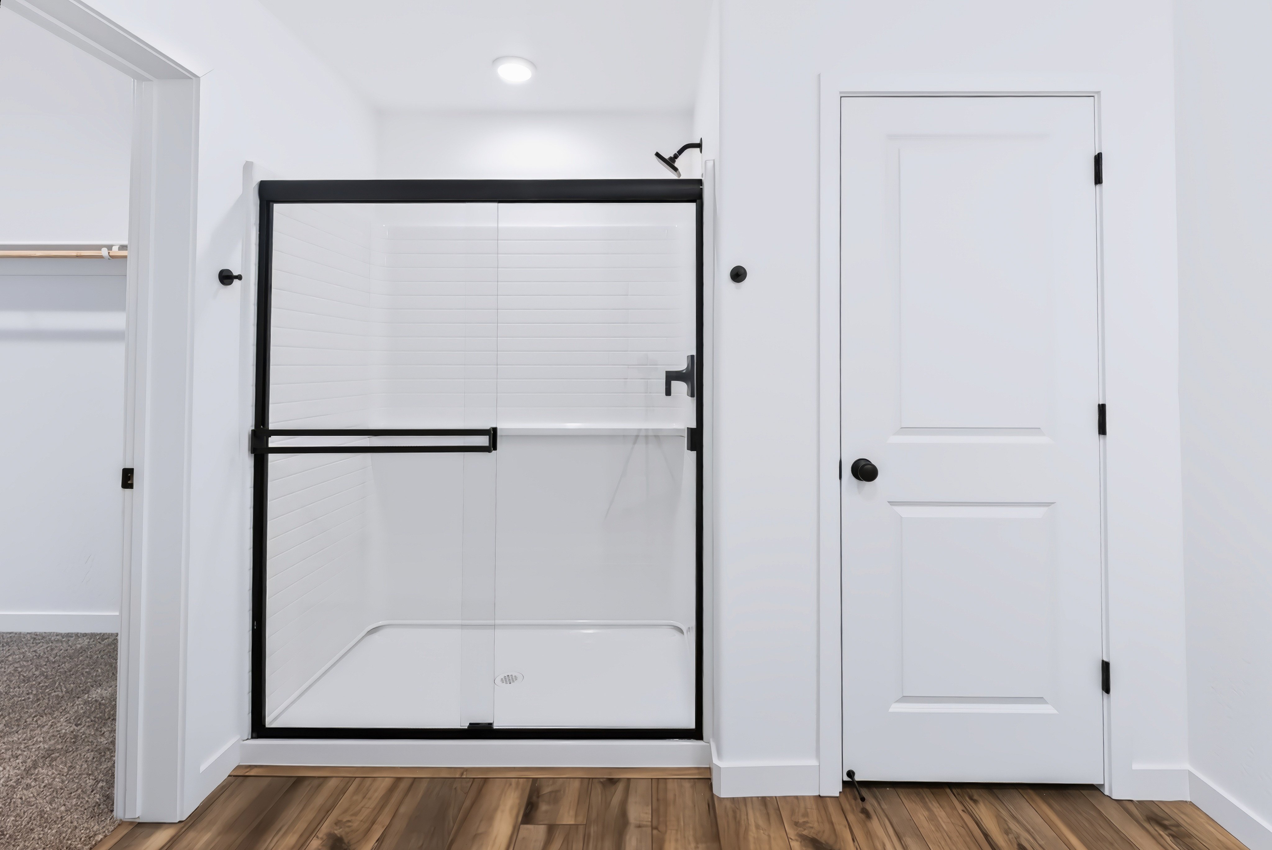 A white cabinet with a door.