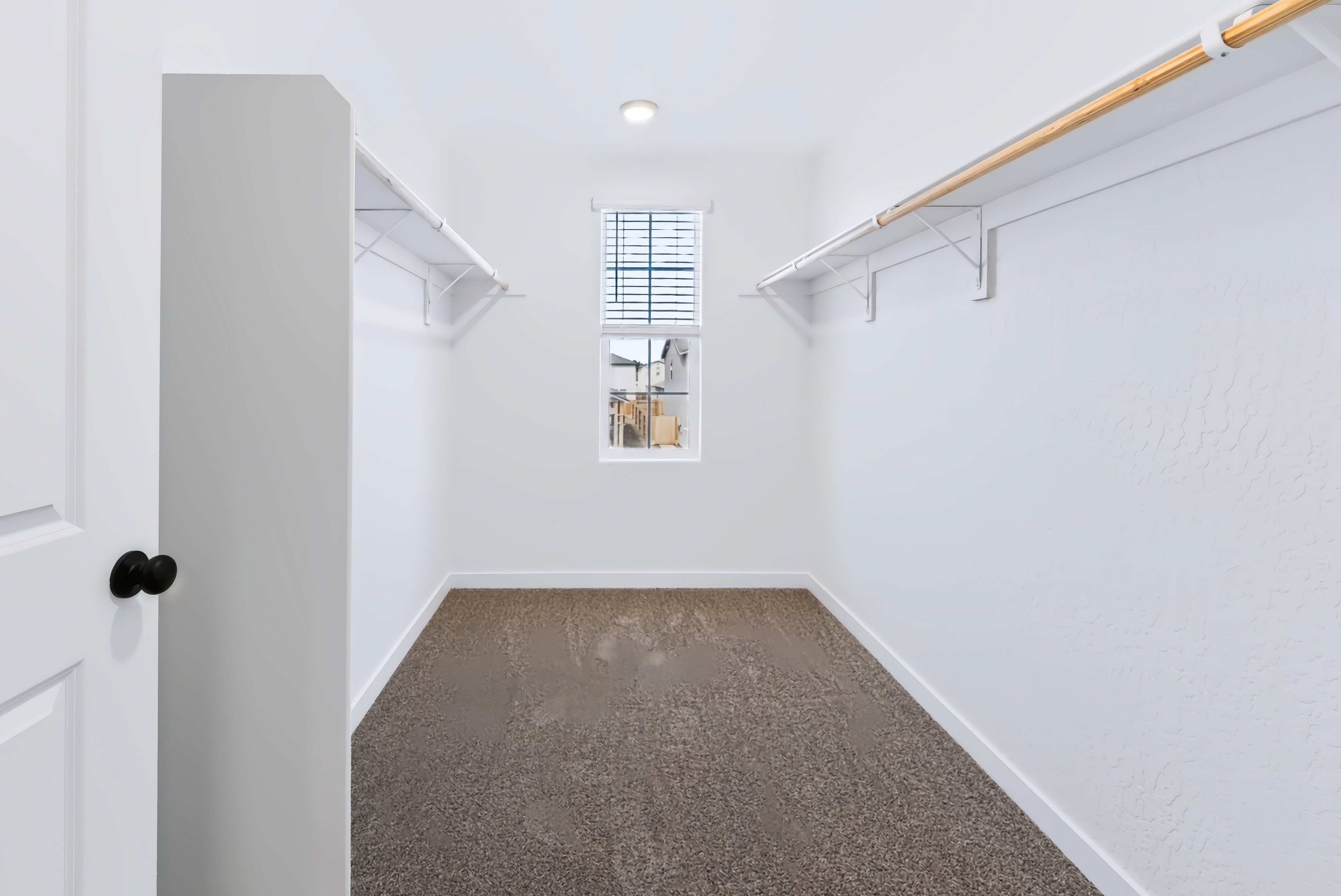 A hallway with white walls.