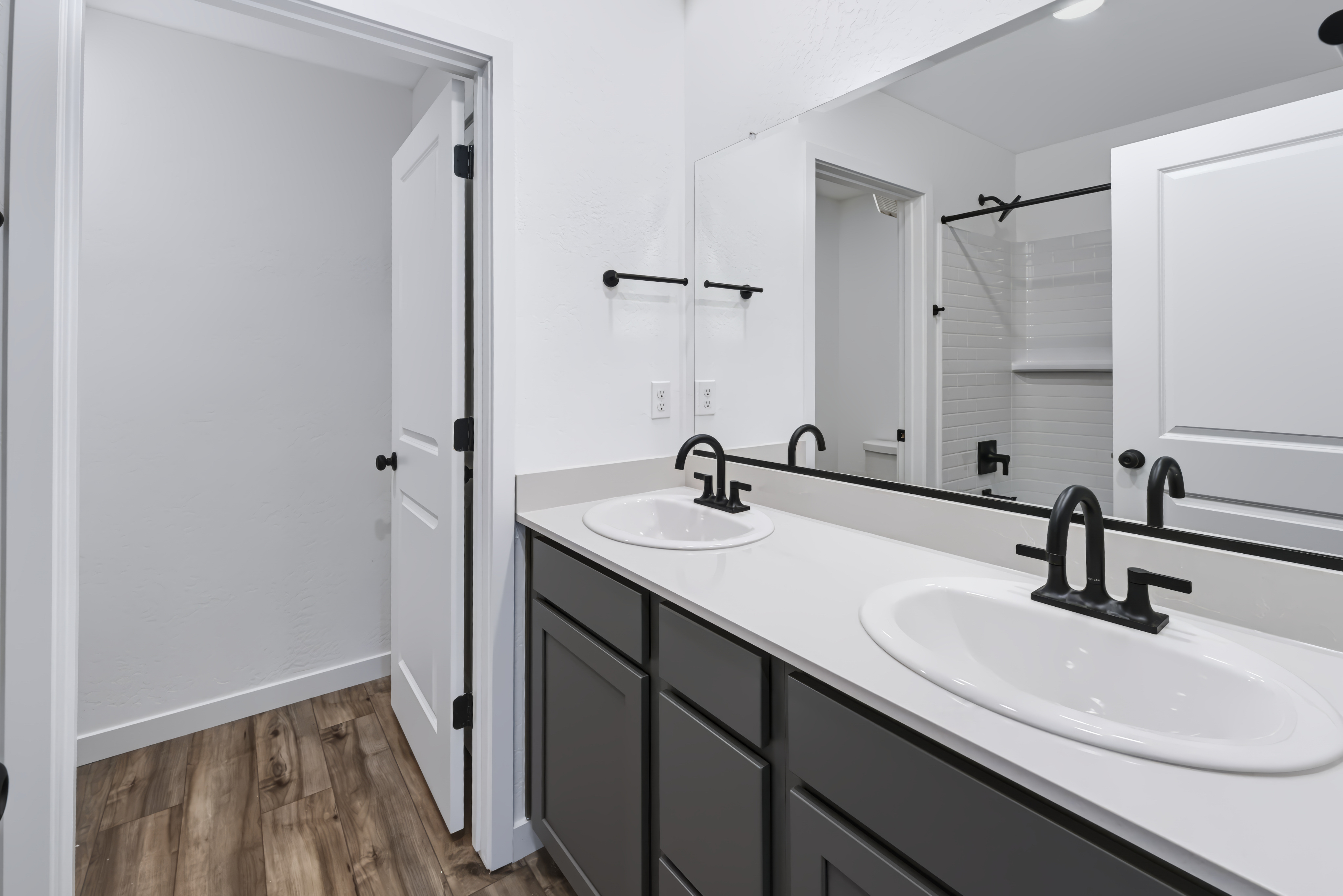 A bathroom with two sinks.
