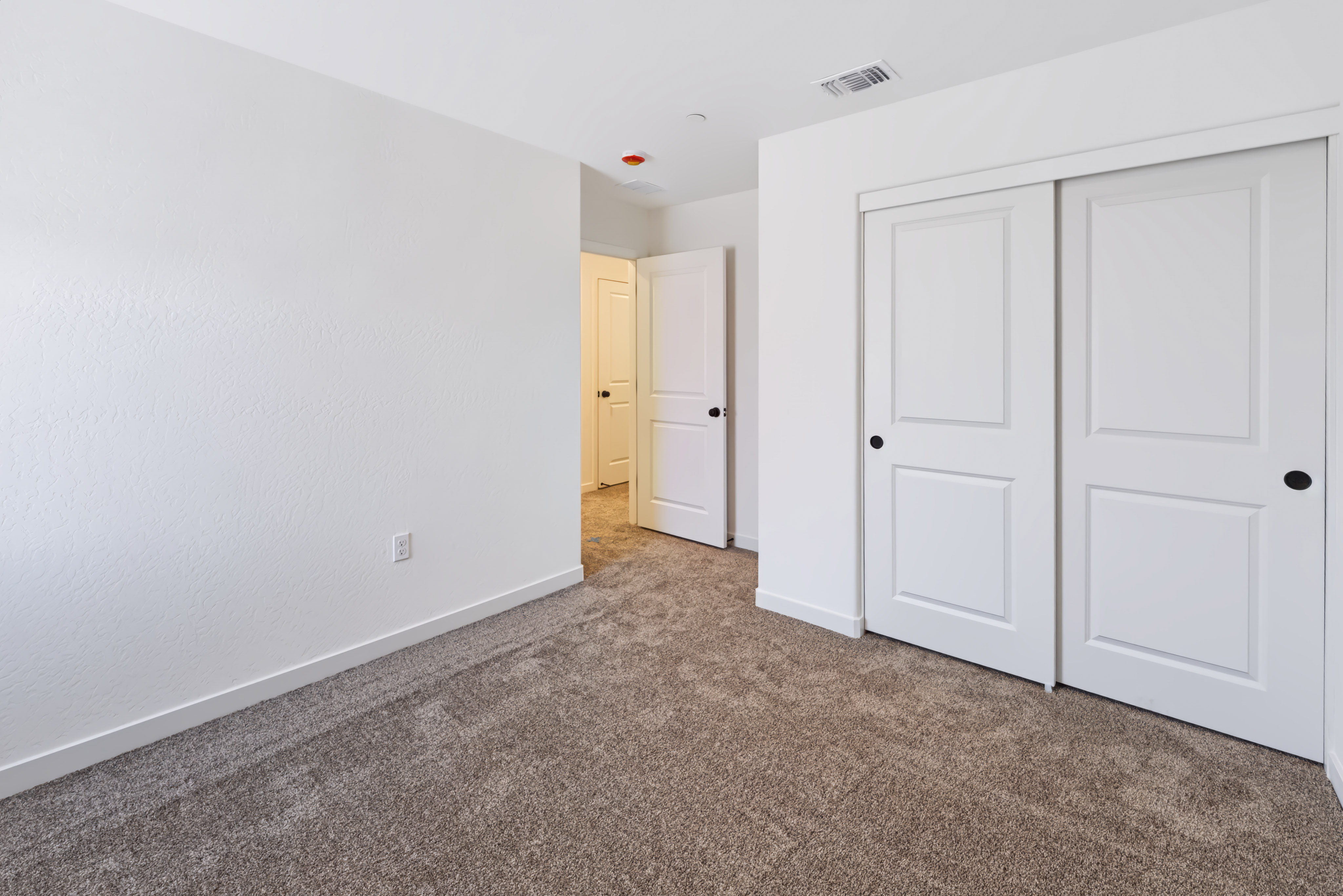 A room with white doors.