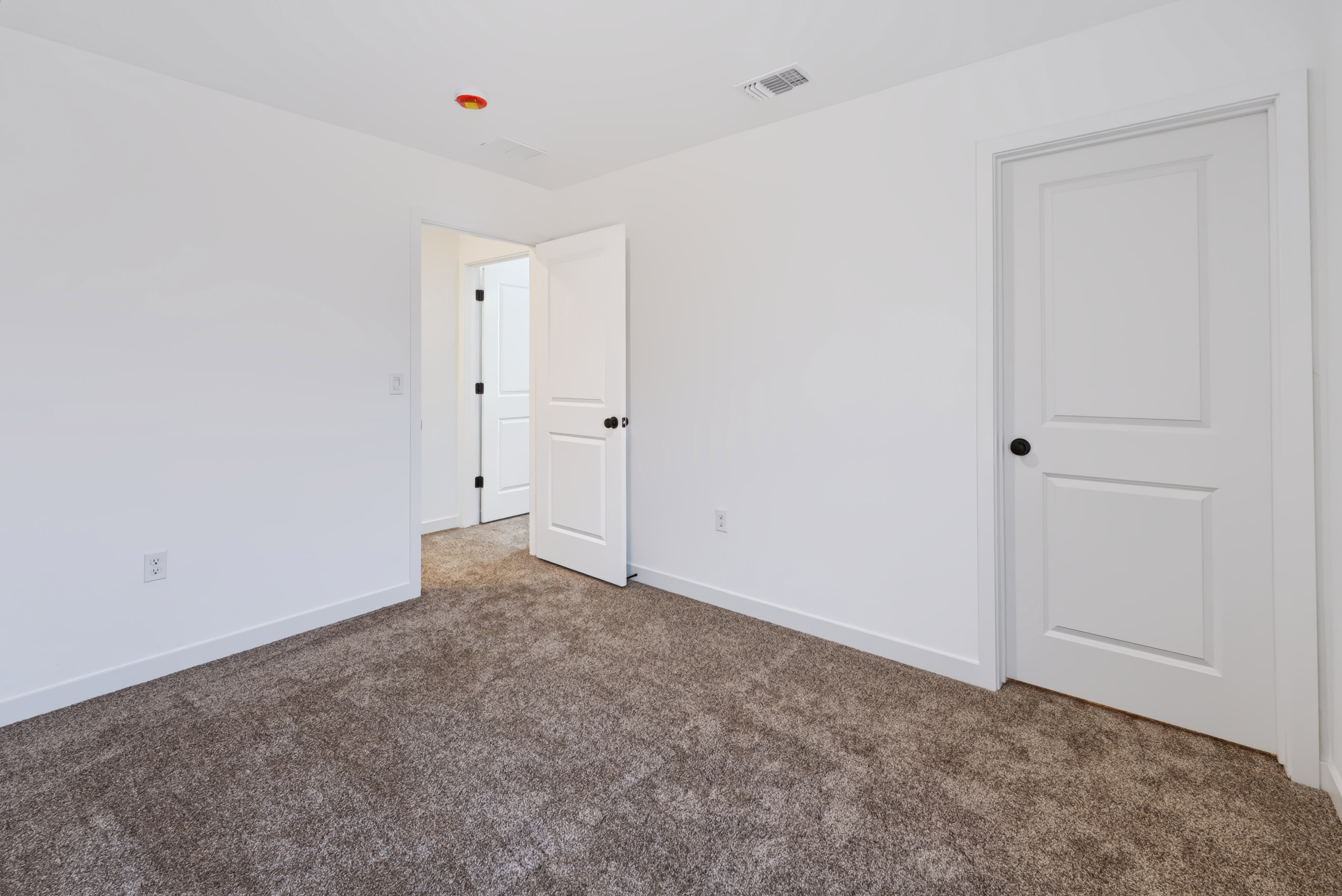 A room with white doors.