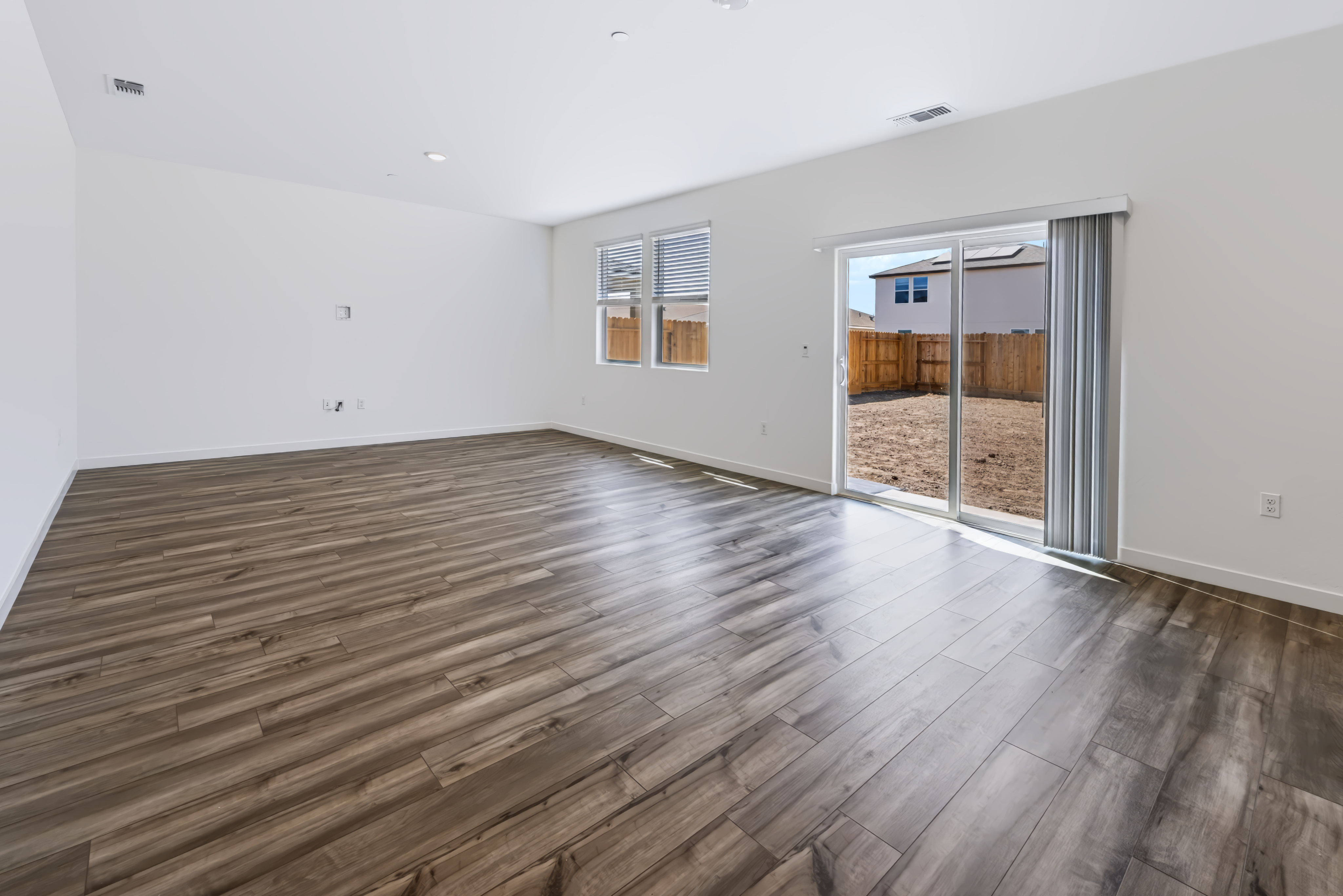 A room with a wood floor and a wood floor.