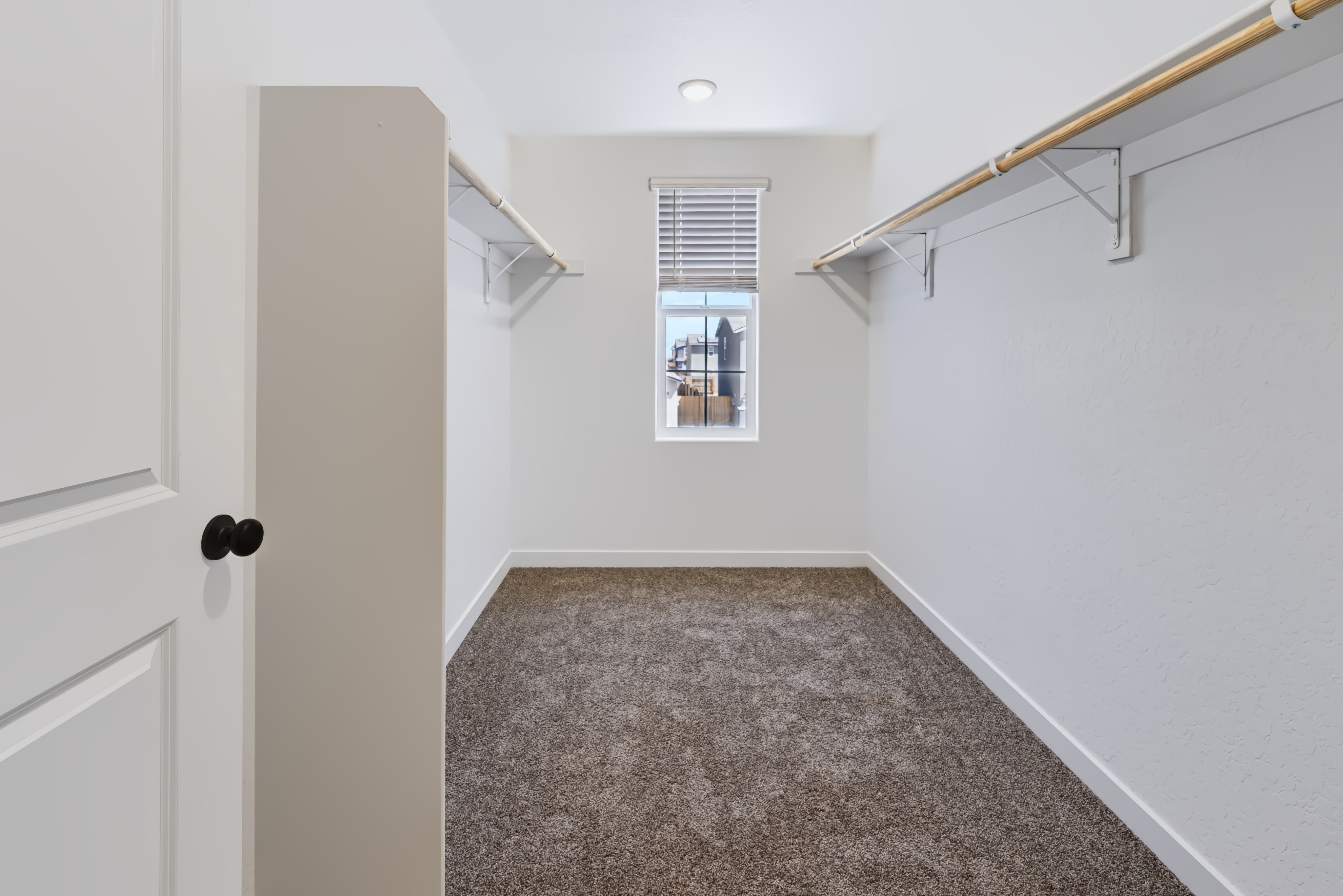 A hallway with white walls.
