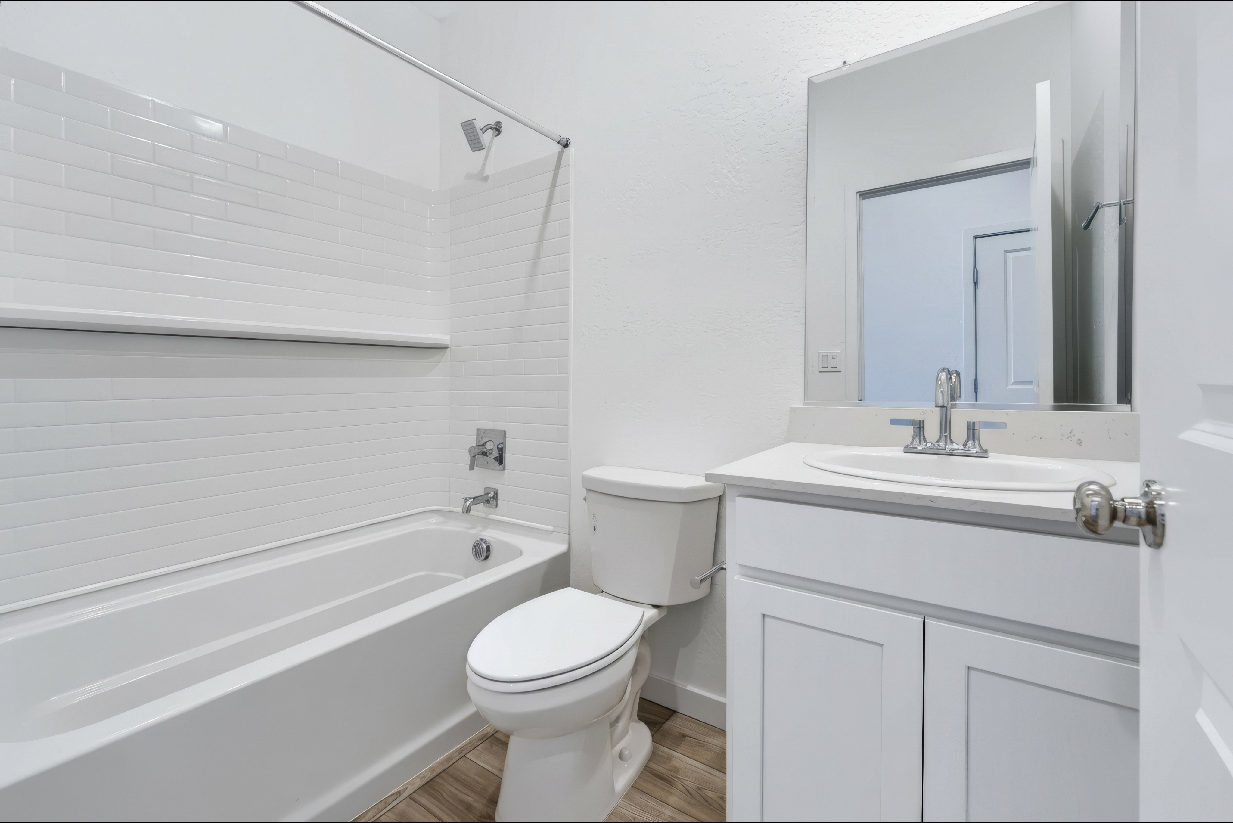 A bathroom with a toilet and sink.