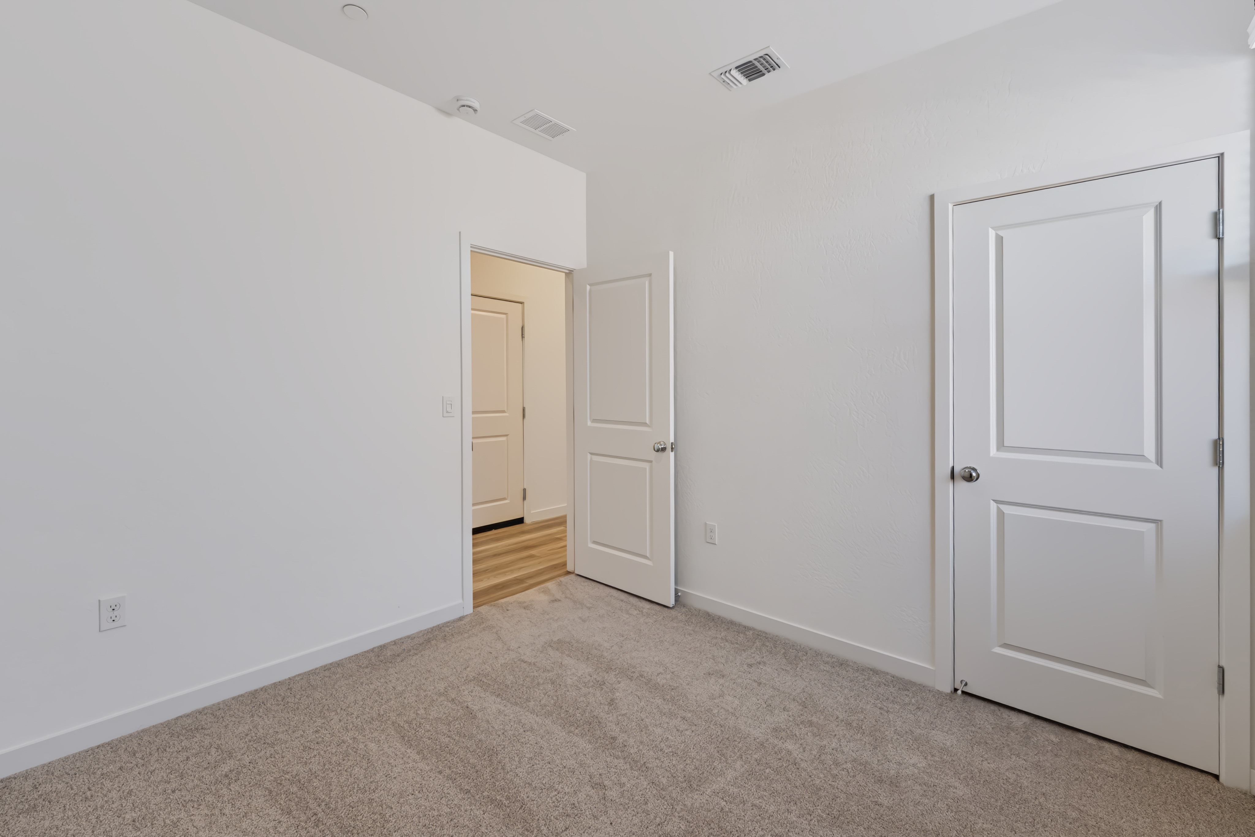 A room with white doors.