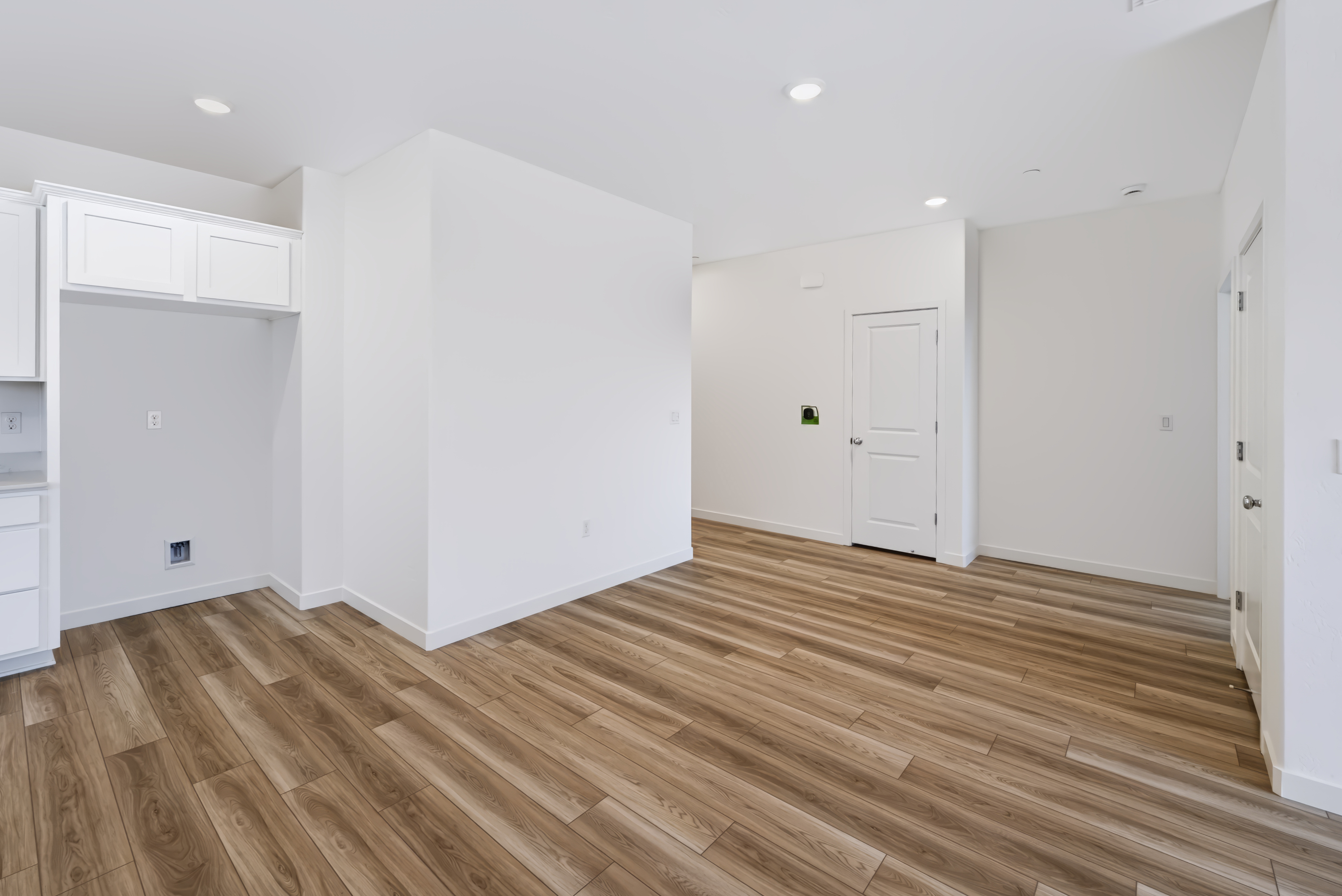 A room with white cabinets.