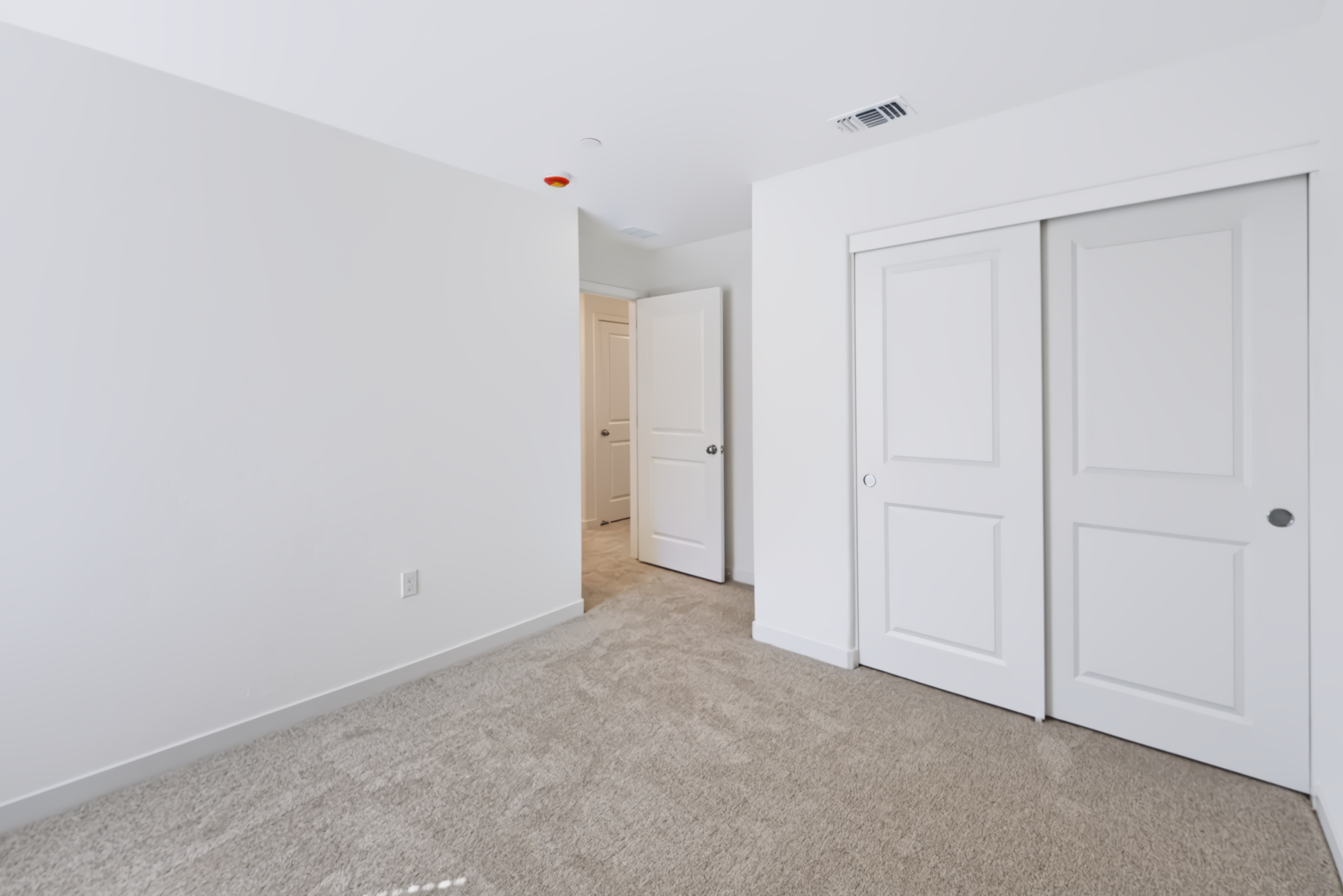A room with white doors.