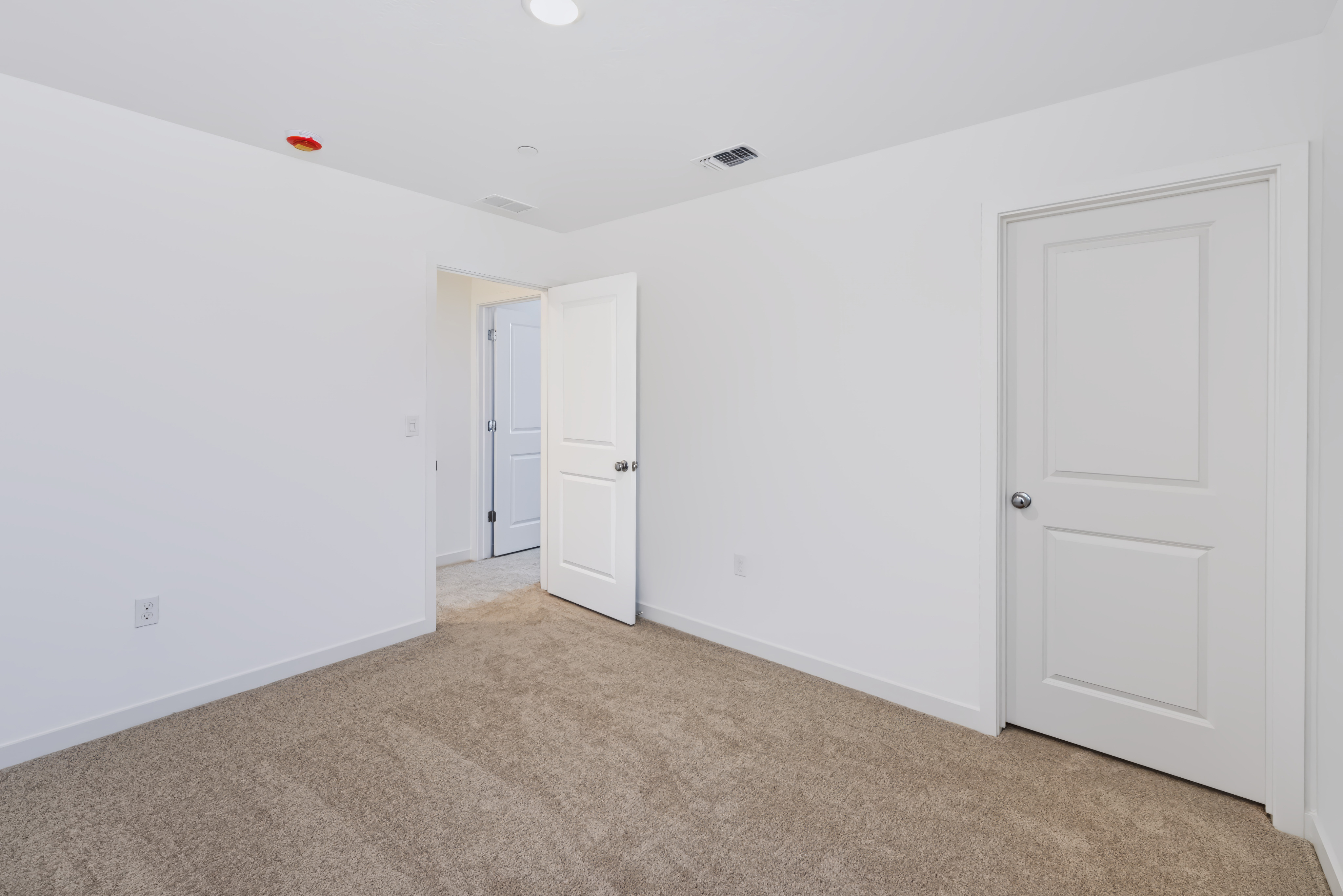 A room with white doors.