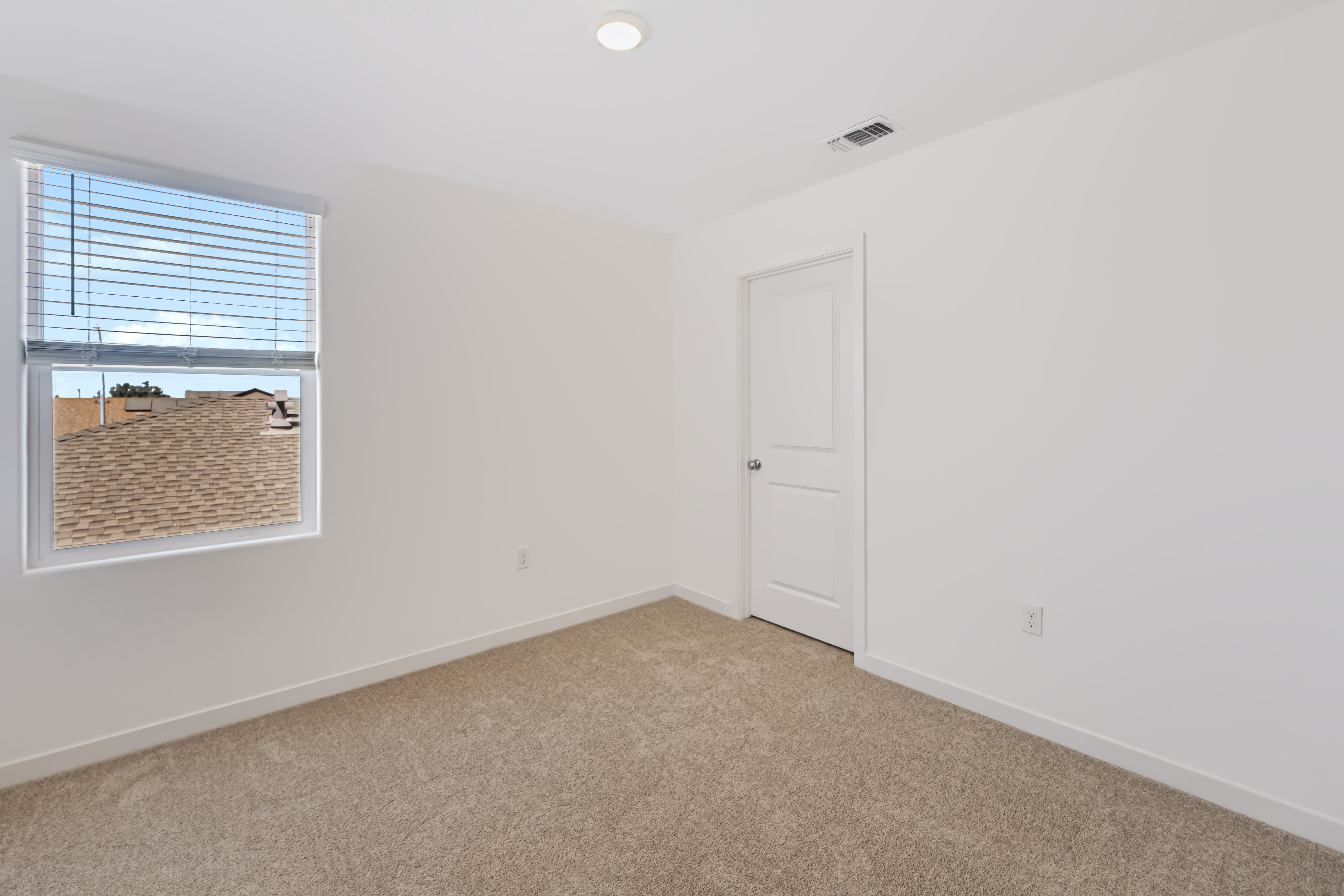A room with a door and a window.