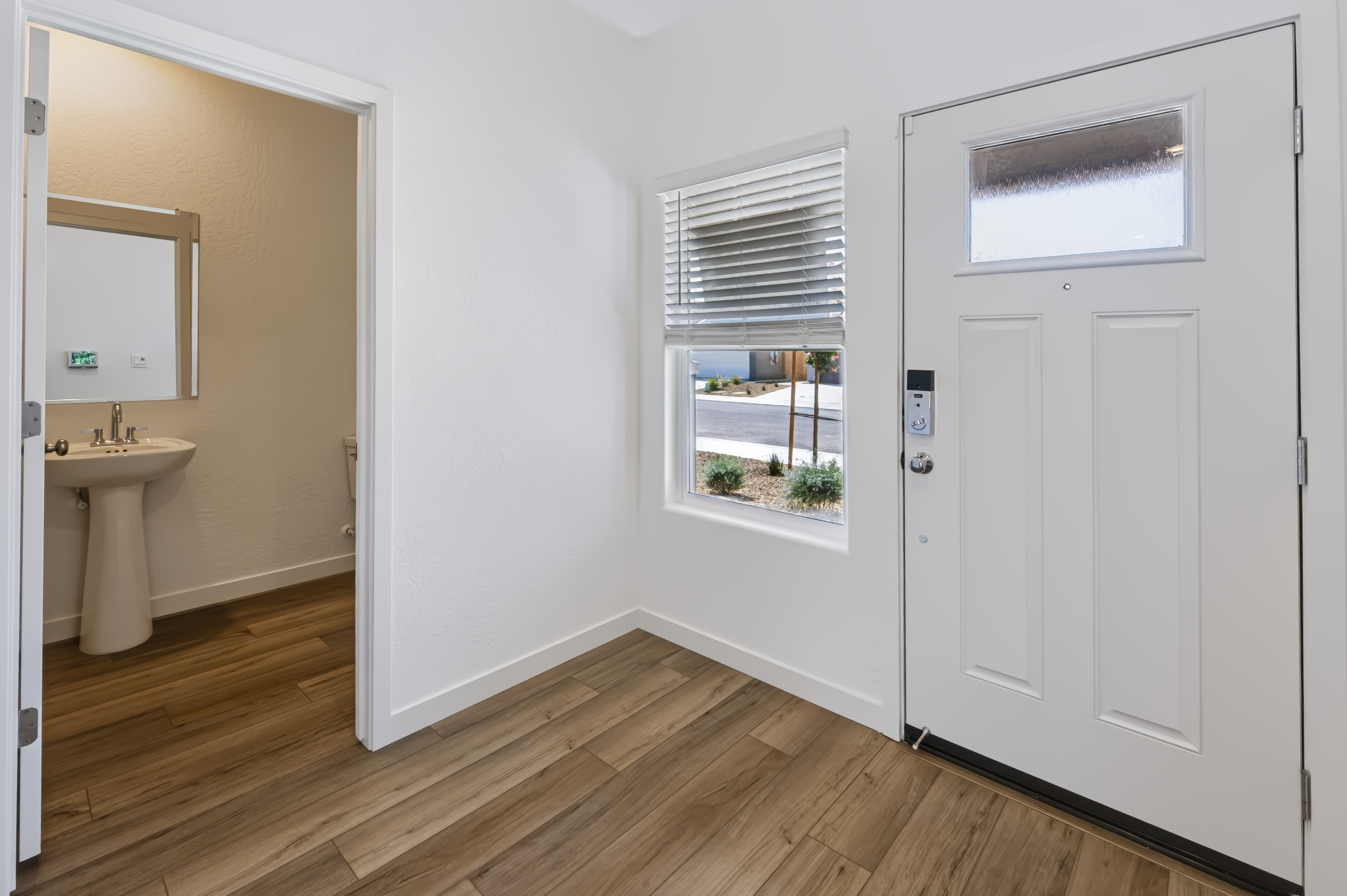 A bathroom with a sink and a window.