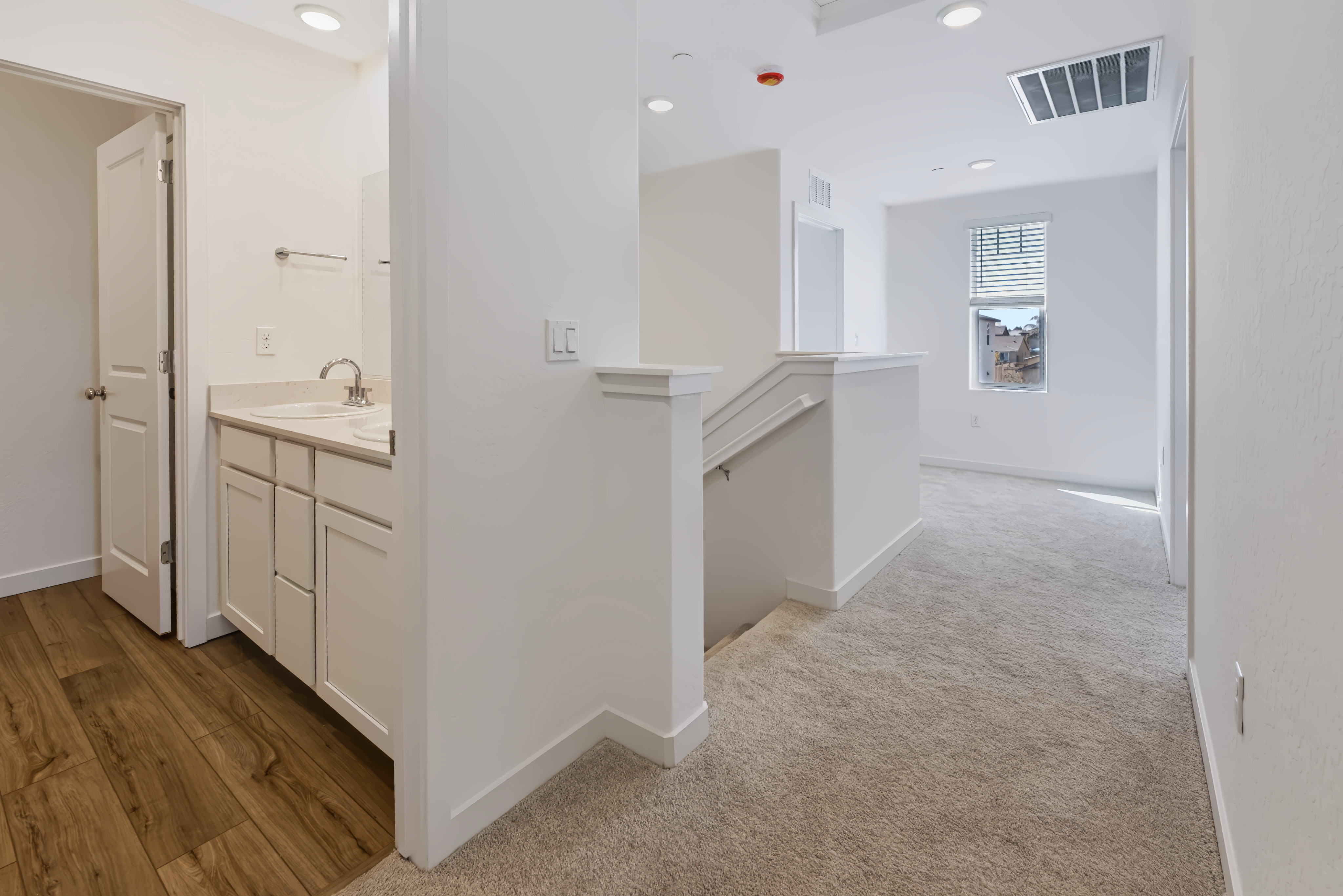 A bathroom with white walls.