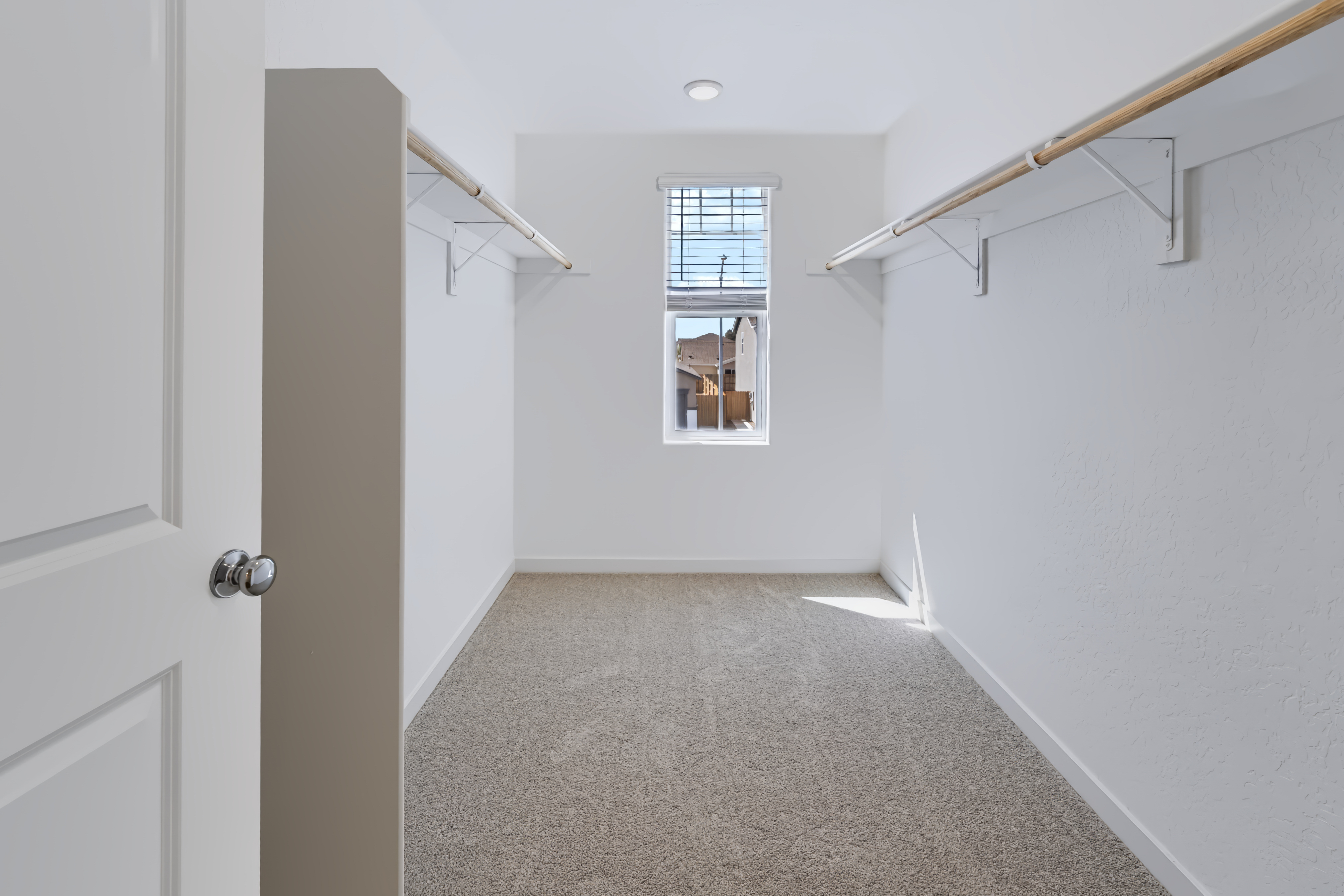 A hallway with white walls.